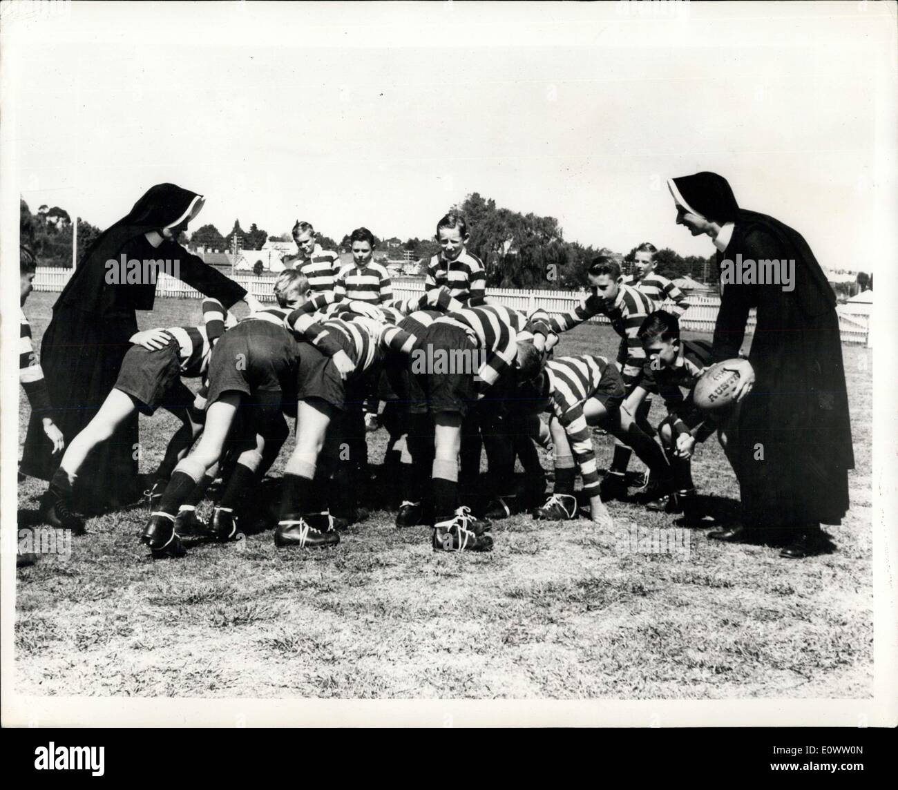 Apr. 13, 1964 - Sisters In The Scrum: The Roman Catholic nun in Australia are reveling in their success in the hitherto all-male preserve of Rugby Union coaching, They are Sister Mary Sebastian, principal of our lady of the Scared Heart School at Bowral, and the sports mistress Sister Mary Xaverine. They have both been interested in game since they were youngster, and have learned a great deal of the theory of the game from books and the newspapers, which they pass on to their pupils Stock Photo