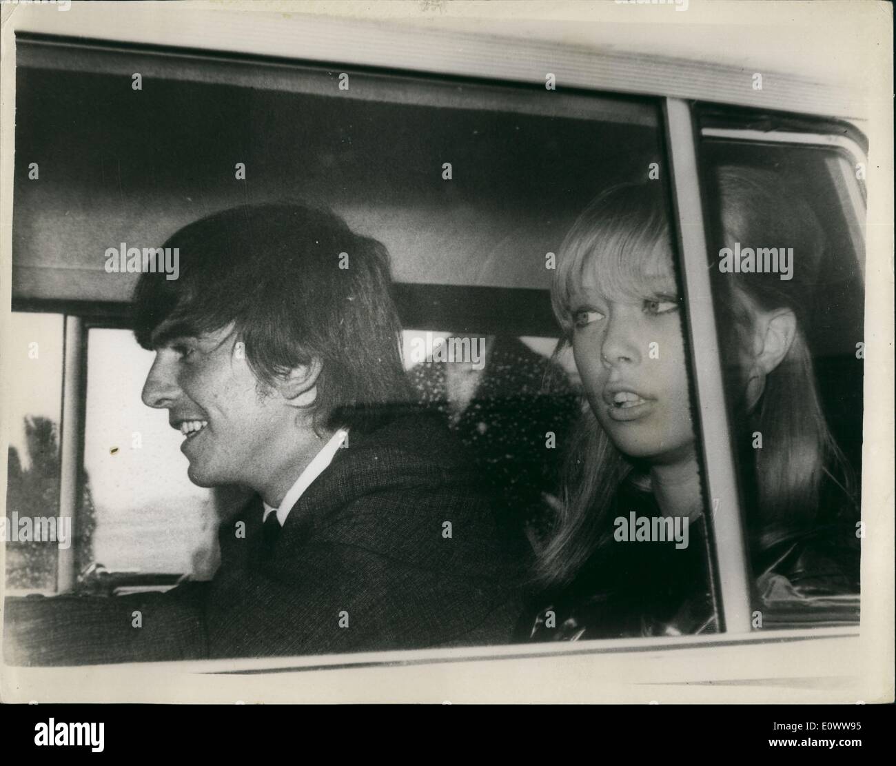 May 05, 1964 - Bealtes return from holiday: John Lennon and George Harrison of the Bealtes, arrived at London Airport last night after their month long holiday on an island in the South Seas. John was accompanied by his wife Cynthia, and George by his actress girl friend Patti Boyd. Next Thursday the whole group fly to Copenhagen to begin a tour which will take them through Hong Kong to Australia. Photo shows George Harrison and Patti Boyd on their return yesterday. Stock Photo