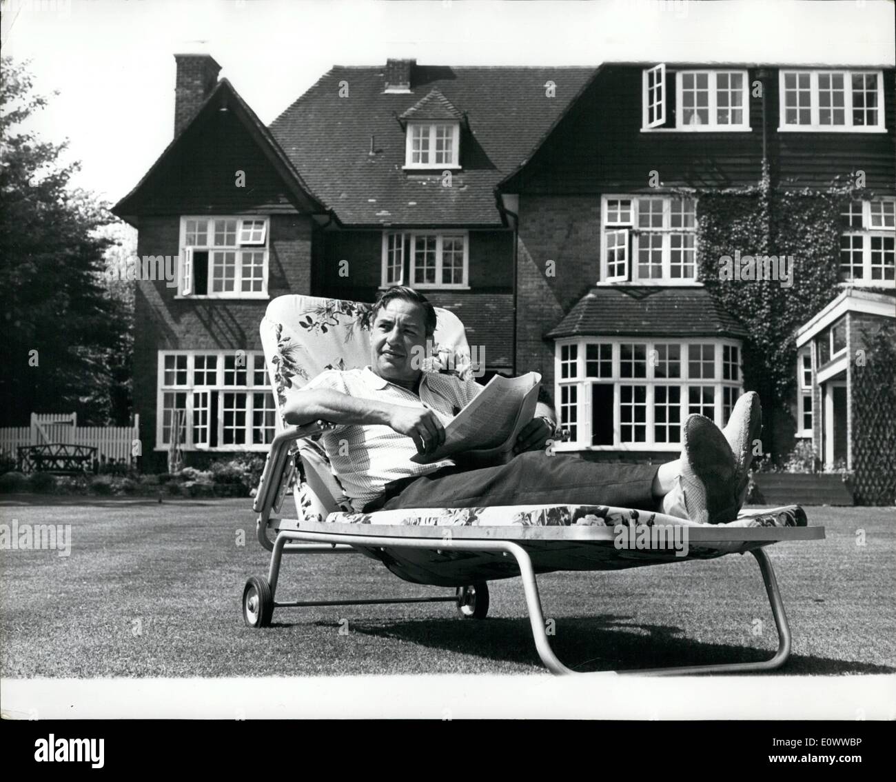 May 05, 1964 - The Man who dared to attack the Beatles. Relaxing in the sun on the lawn of his home in Chislehurst, Kent, is Lord Willis (scriptwriter Ted Willis and creator of the Dixon of Dock Green Series) who deos not appear worried by the remarks which followed his attack on the Beatles during a House of Lord debate on leisure. He called the modern pop ''a primitive dance a ritual pep pill. Stock Photo