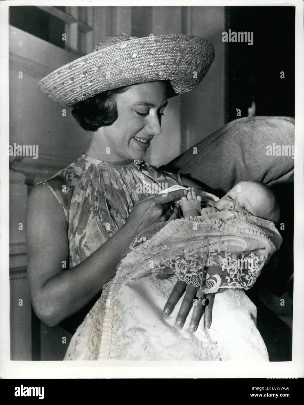 Jul. 07, 1964 - Princess Margaret's Daughter Lady Sarah is Christened at Buckingham Palace. Lady Sarah Armstrong Jones, the 2 month old daughter of Princess Margaret and the Earl of Snowdon, was christened in the private chapel of Buckingham Palace today. This ceremony was conducted by the Very Reverend Eric Abbott, the Dean of Westminster. Photo Shows: Princess Margaret pictured with her baby daughter Lady Sarah Armstrong Jones as they left their Kensington Palace home for Buckingham Palace today. Lady Sarah in seventh in line of succession to the throne. Stock Photo