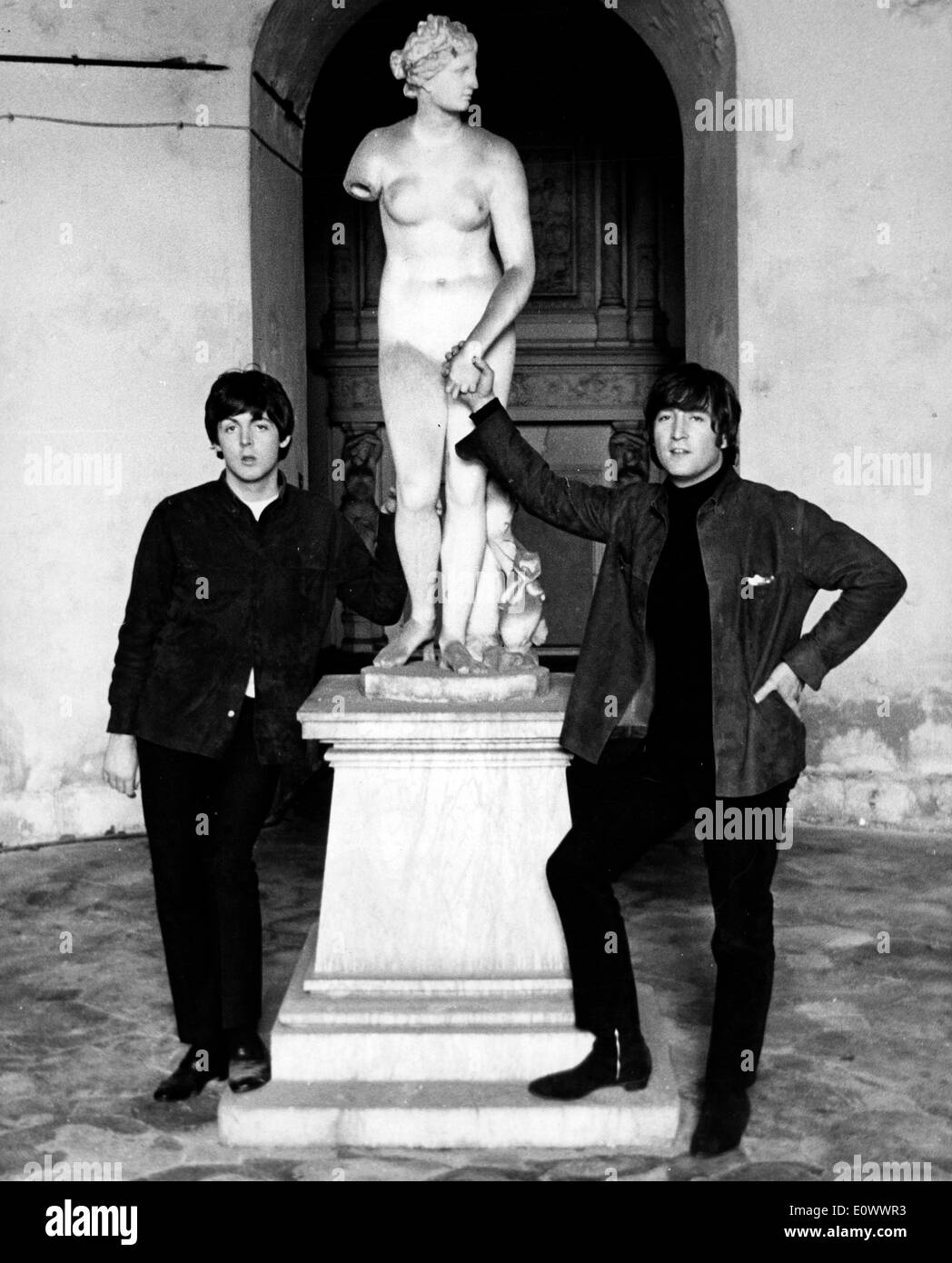 The Beatles Paul McCartney and John Lennon meet stone lady in London Stock Photo