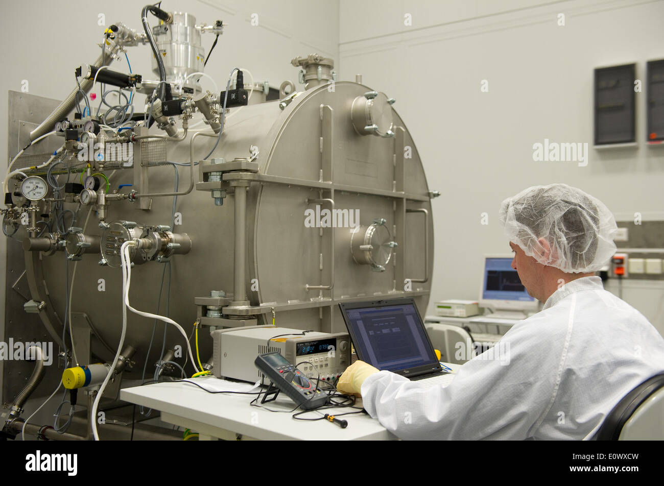 Laboratory worker Aron Kramer tests a vacuum pump at the Max Planck