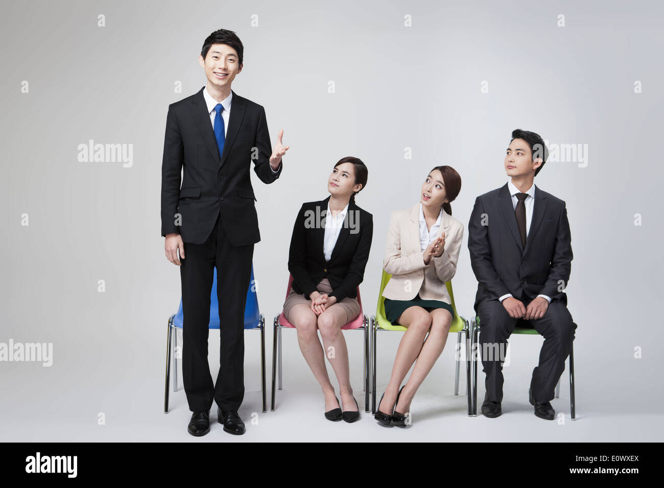 business people sitting in a row Stock Photo - Alamy