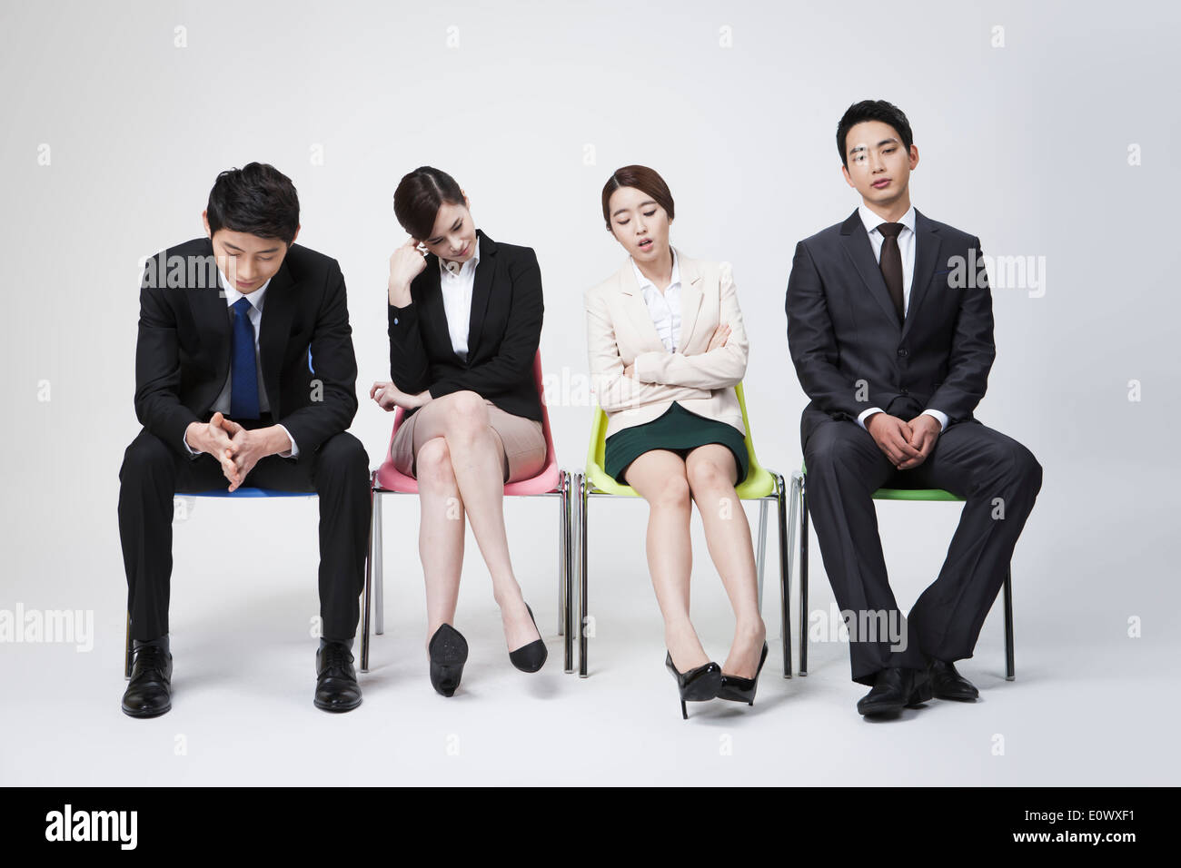 business people sitting in a row Stock Photo - Alamy