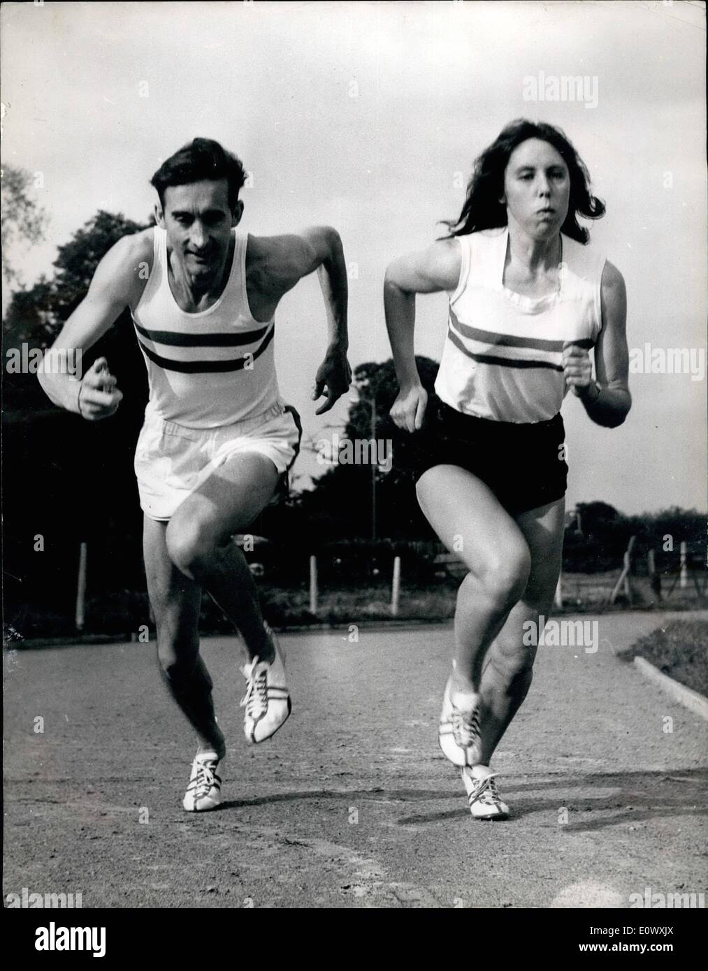 Aug. 08, 1964 - Anne Gets Ready for Tokyo. Entry in the 800 meters Event: Attractive twenty two year old sprinter Anne Smith daughter of a London newspaper linotype operator and who teaches at Convent of the Sacred Heart in Hammersmith - is now in training for her visit to Tokyo as a member in the 800 Matres event says she owes her success to the one ad only Gordon Pirie - former world record holder who trained her. Gordon spends a lot of his time - coaching Anne of the Pirie home at Redhill Stock Photo