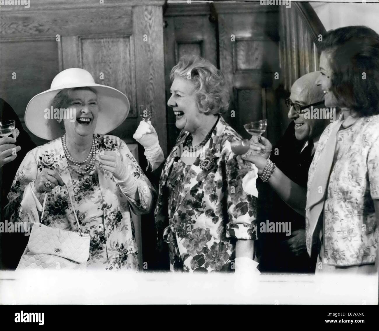 Jun. 06, 1964 - Dame Sybil's 60 Years Of Glory: A party was given yesterday for star actress Dame Sybil Thorndike who was celebrating the 60th anniversary of her stage debut. 81-year-old Dame Sybil is at present appearing in ''The Reluctant Peer'' in the West End. Phot shows Dame Sybil Thorndike (left) receives toast from fellow actors and actresses (let to right) Cicely Courtenidge, Robertson Hare and Margaret Lockwood. Stock Photo