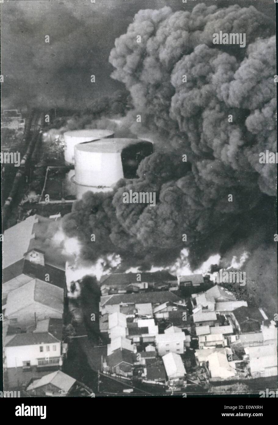 Jun. 06, 1964 - Earthquake Disaster In Niigata Japan: The city of Nigate is a blazing shambles after the severe earthquake which took place at 1.02pm on Tuesday isolating it fo the rest of Japan as railway lines buckled, and the runway of the airport partly disappeared, there is now water, electricity od sewerage remaining and thousands are homeless. The prt of Niigate, one of the Principal oil refining cities, suhfered a double catastrophy as oil tanks burst spreading blazing oil over hundreds of houses nearby, destroying 291 of them Stock Photo