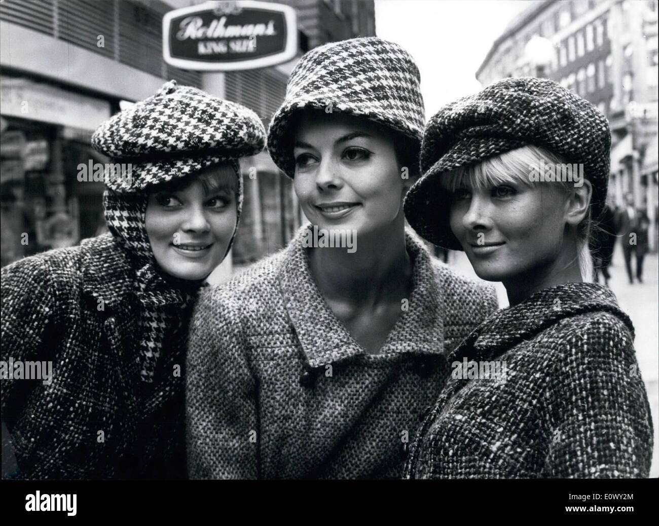 Aug. 08, 1964 - The Millinery Institute's Autumn and Winter Collection Shown at the Mayfair Hotel. Photo Shows: Models (L. to R.) June Fry, Jill Wright and Jenny Wilson, wearing a collection of hats called Tomboy, with its own matching balaclava. Stock Photo