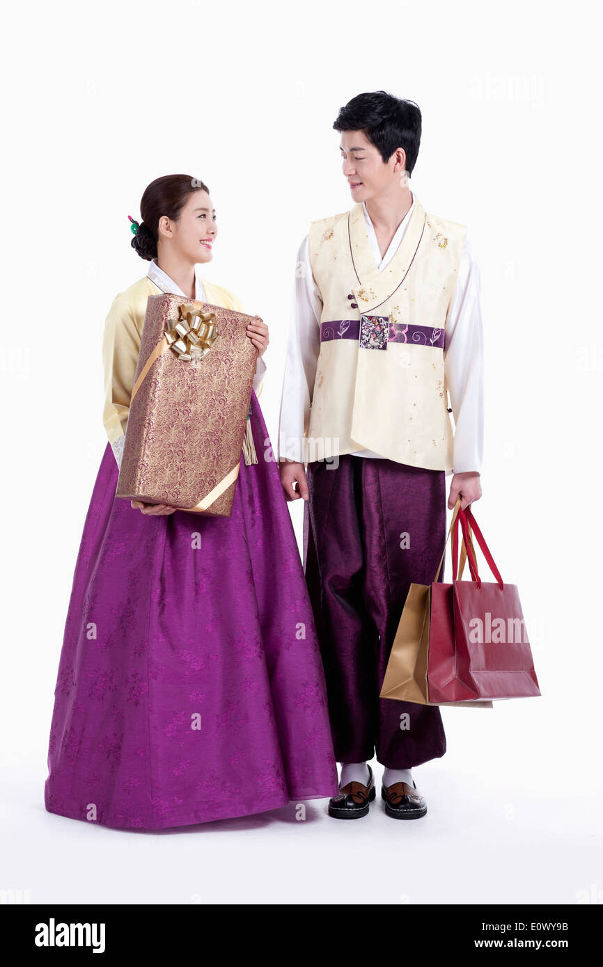 a couple wearing traditional Korean outfits Stock Photo - Alamy