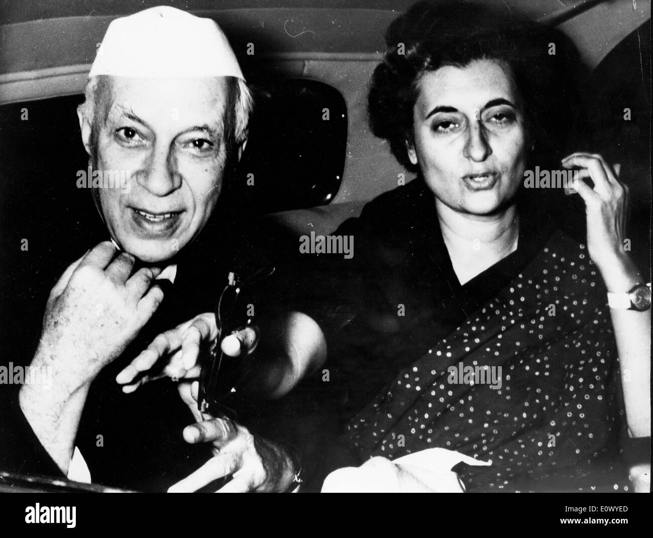 Indira Gandhi and father Jawaharlal Nehru riding in a car Stock Photo