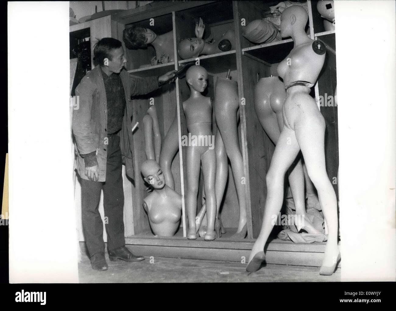 Aug. 26, 1964 - Classification... has to be also in the wardrobe of the ''artificial mannequins''. In this great store, where the puppets are necessary, cleans this young apprentice the ladies ; and you can not say, that he doesn't like his work. Stock Photo