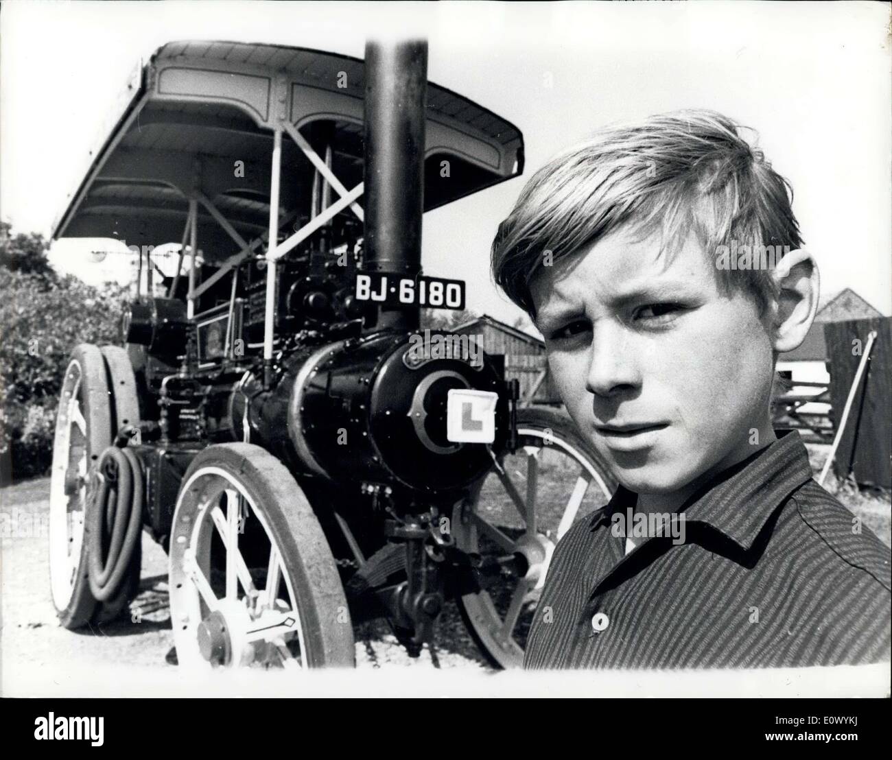 Sep. 03, 1964 - Tommy Wanted a Scooter - but dad Bought Him a Traction Engine Instead: former's son wanted a motor scooter for his 16th. 700 acre farm nr. Little Downham, Cambridge shire - bought him a traction engine instead. It will be a year before he can take a test to drive his traction engine on the roads - A car licence is all he need Tommy- who has named his engine ''The Pride of the Fens'' ays there are plenty of roads on the farm on which he can drive his engine - which - incidentally will only travel about a mile for a hudredweight of coal Stock Photo