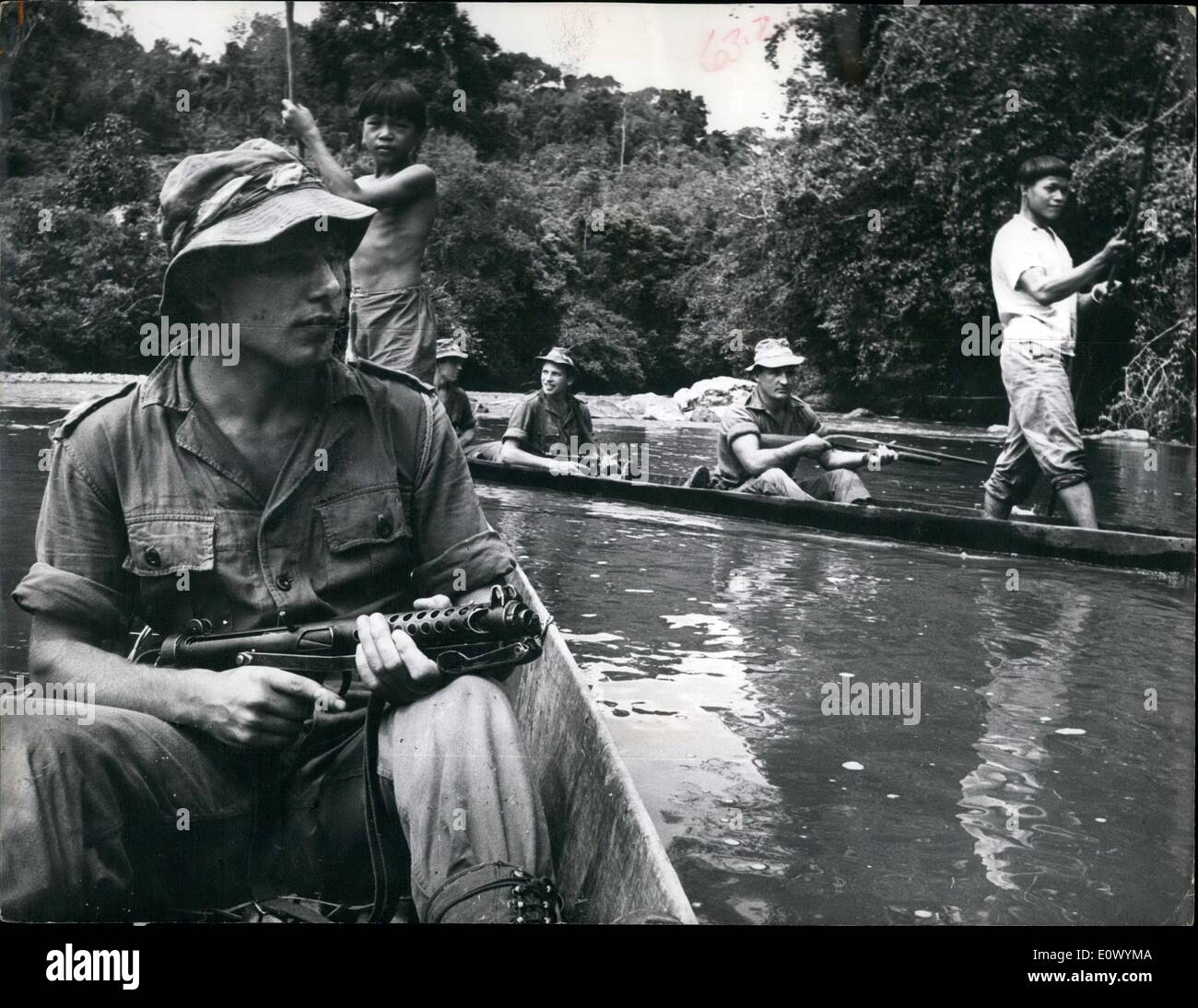 Sep. 09, 1964 - Fighting With Guns - And Kindness -in Borneo. Battle Against Terrorists - and Disease. Photo shows Argyll and Sutherland Highlanders on River Patrol on the Sungai Banga in foreground in leading boat. 2nd. Lieut. Tim Kilpatrick 19 yr old platoon commander Stock Photo