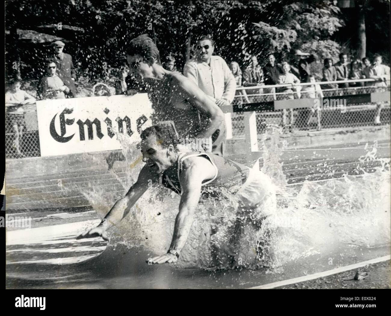 Sep. 09, 1964 - They took a cropper: The team of sportsmen of the Ligue Ile De France and the team of champagne competed in a match at Saint-Maur Sunday. Two runners take a cropper during the 3.00M. steeple race. Stock Photo