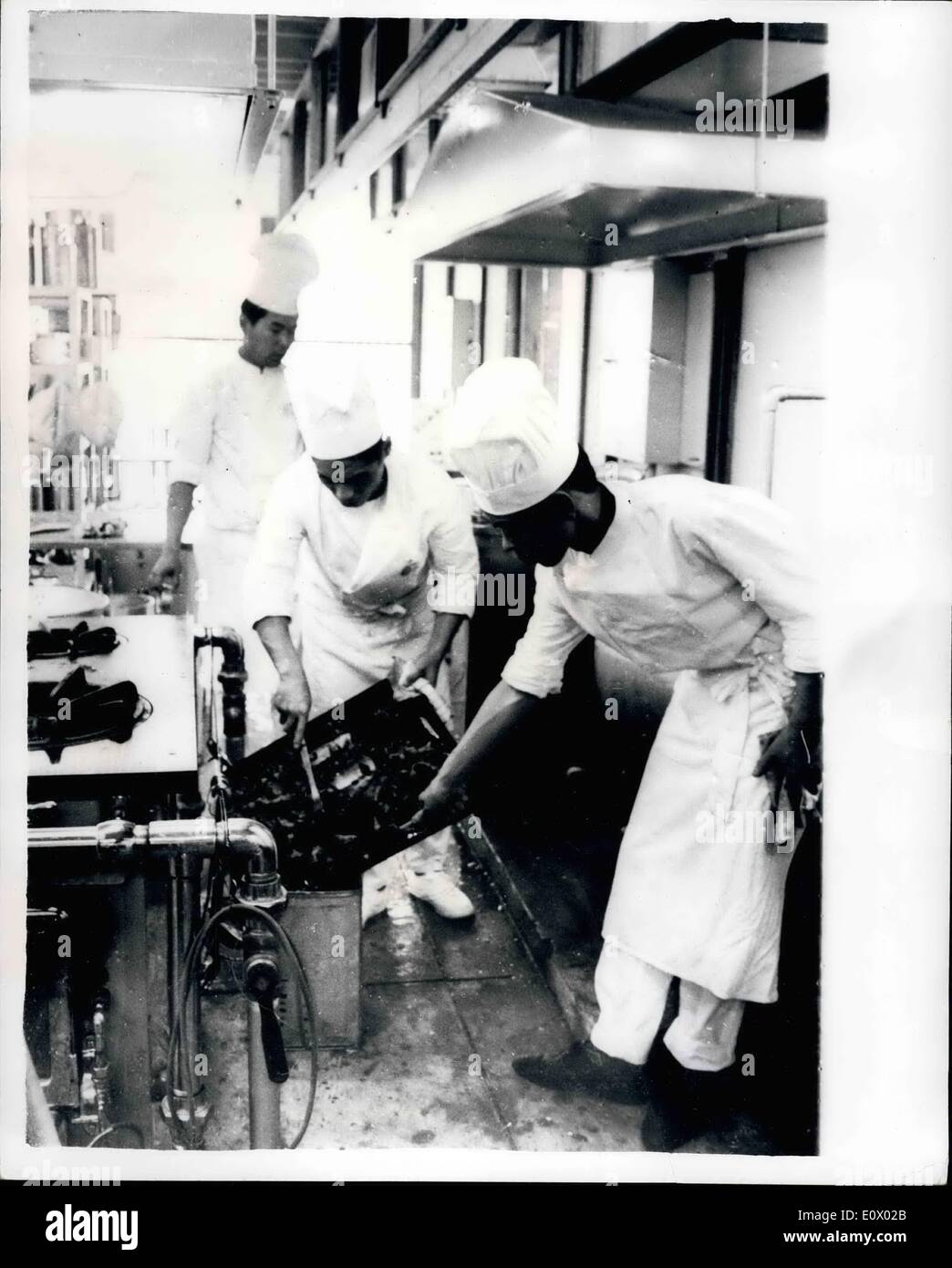 Sep. 09, 1964 - Olympic Village Chefs Light Up The Ovens: Chefs at the Olympic Village Commanded the works of supplying meals to the first athletes to arrive in Tokyo for the Olympic Games Photo Shows A busy scene in the Ki6tchens of the Olympic Village at Yoyogi, Tokyo, where the athletes will lives. Stock Photo