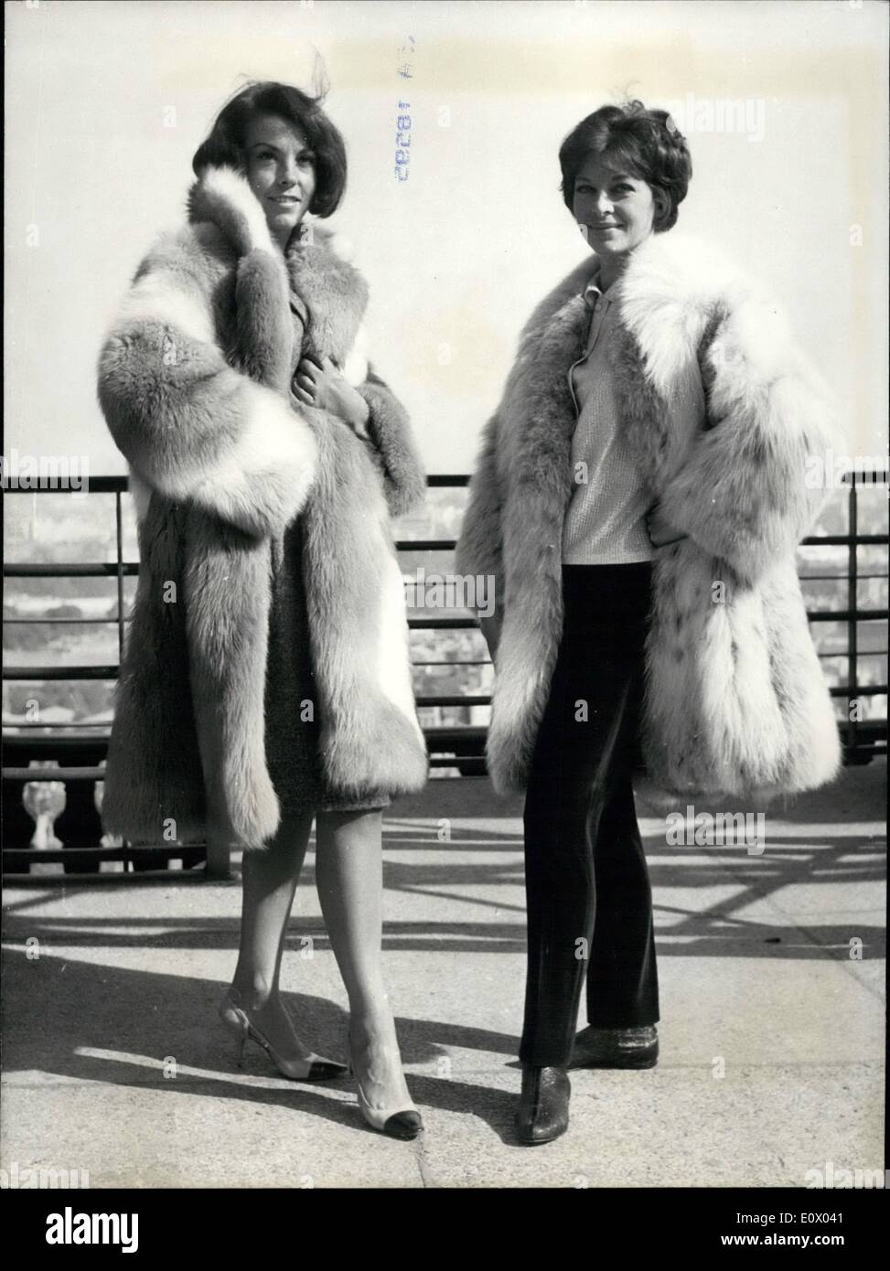 Sep. 09, 1964 - Fashion show on Eiffel Tower: The Eiffel Tower provided a background  for a winter fashion show held yesterday.Photo shows mannequins modelling winter fur coats designed by Brnswick. Stock Photo