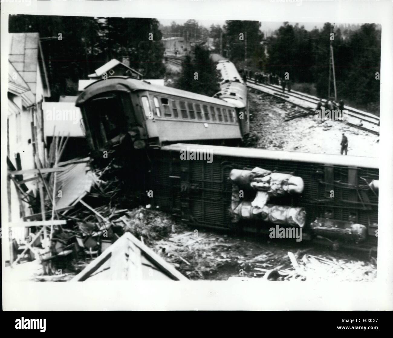 Sep. 09, 1964 - Eight Killed In Swedish Rail Crash: Eight people died and 35 injured when the Stockholm-Narvik express hurtled off the track into a zig-zag of destruction, Carriages smashed through three houses on the edge of the level crossing at Alby, six miles south Asnge, in Northern Sweden yesterday. Nearly all the villagers of Alby turned out to help with the rescue work. Photo shows The wreckage of the train which was derailed at Alby, Sweden, at the weekend. Stock Photo