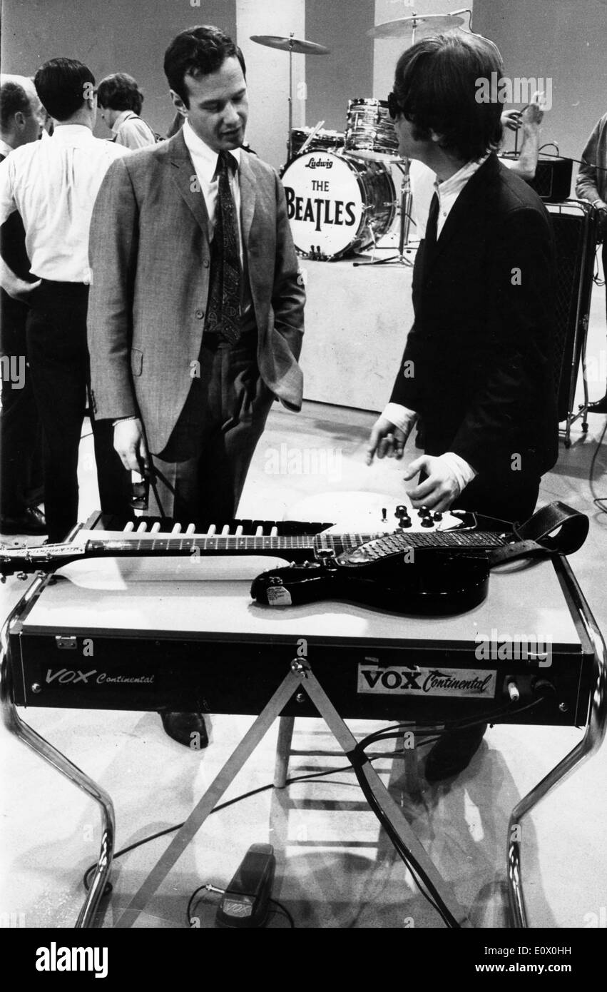 The Beatles Member John Lennon Talking With His Manager Brian Epstein On Set Stock Photo Alamy