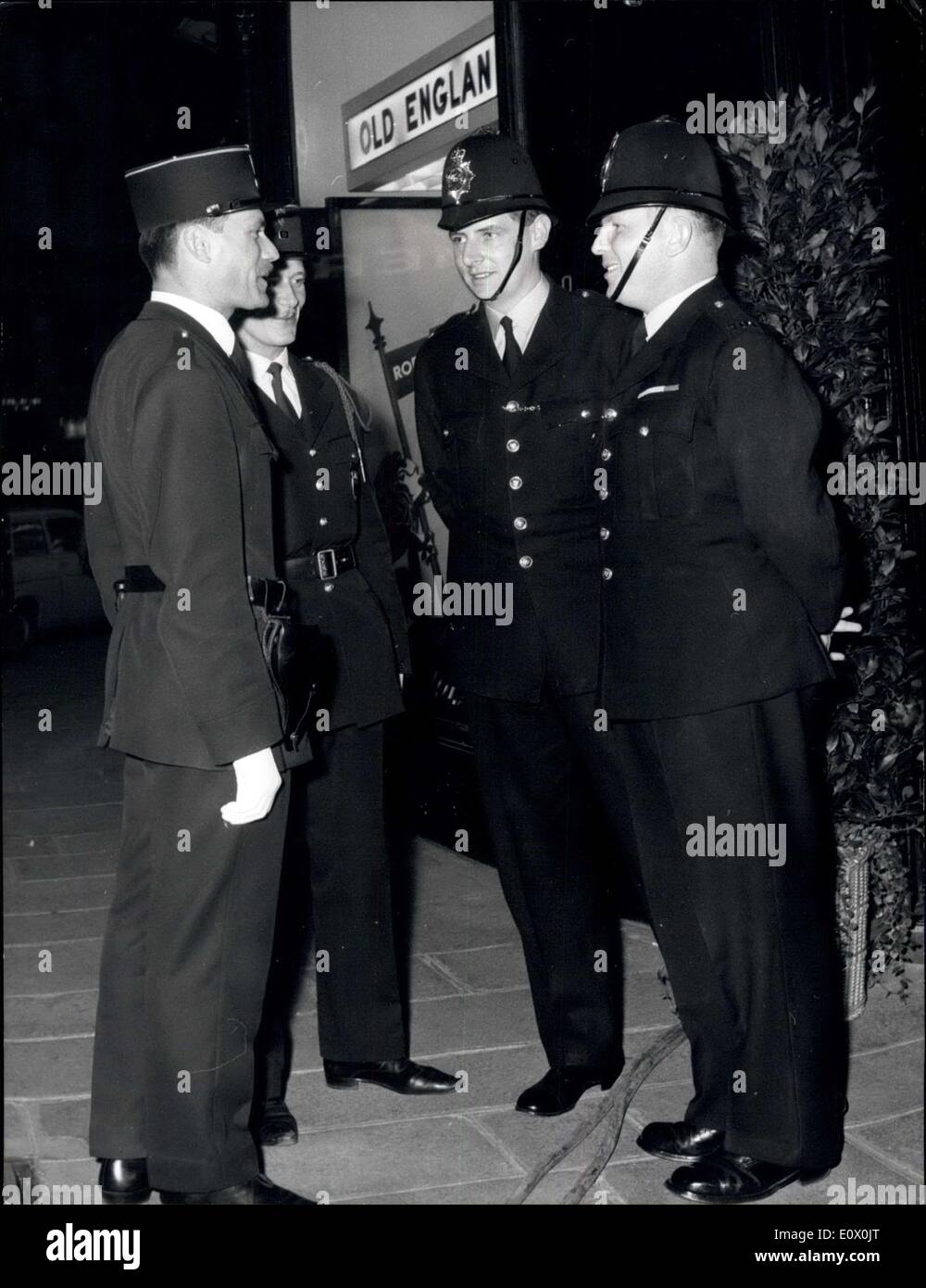 Sep. 24, 1964 - French And English Policemen Meet At ''Old England'': A cocktail party organised by the British Men's wear guild was held at ''Old England'', The famous shop near the opera, last night. Photo Shows: Two bobbies from surrey have a friendly chat with two pairs policemen in front of ''Old England'' last night. Stock Photo