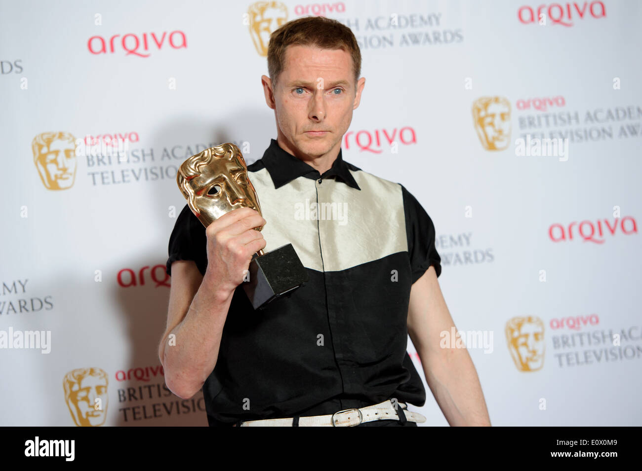 Sean Harris poses for photographers in the winners room at the British Academy Television Awards. Stock Photo