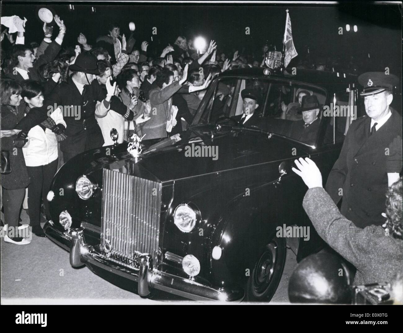 Oct. 10, 1964 - Crowds Cheer The Queen On Her Return From Canada: A large crowd gathered outside Buckingham Palace to welcome the Queen hoke from her visit to Canada last night. Photo shows Cheering crowds mob the Queen's car on arrival home at the Palace last night. Stock Photo