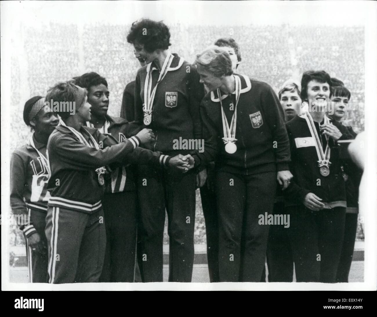 Oct. 10, 1964 - Olympic games in Tokyo. U.S. win the women's 4 x 100 metres relay. Photo shows winners of the Women's 4 x 100 Metres Relay Final, congratulate each other on the winner's rostrum after the presentation of medals. In centre is the winning United States team. On left is the Polish team, who were second, and on right, the British team, who were third. Stock Photo
