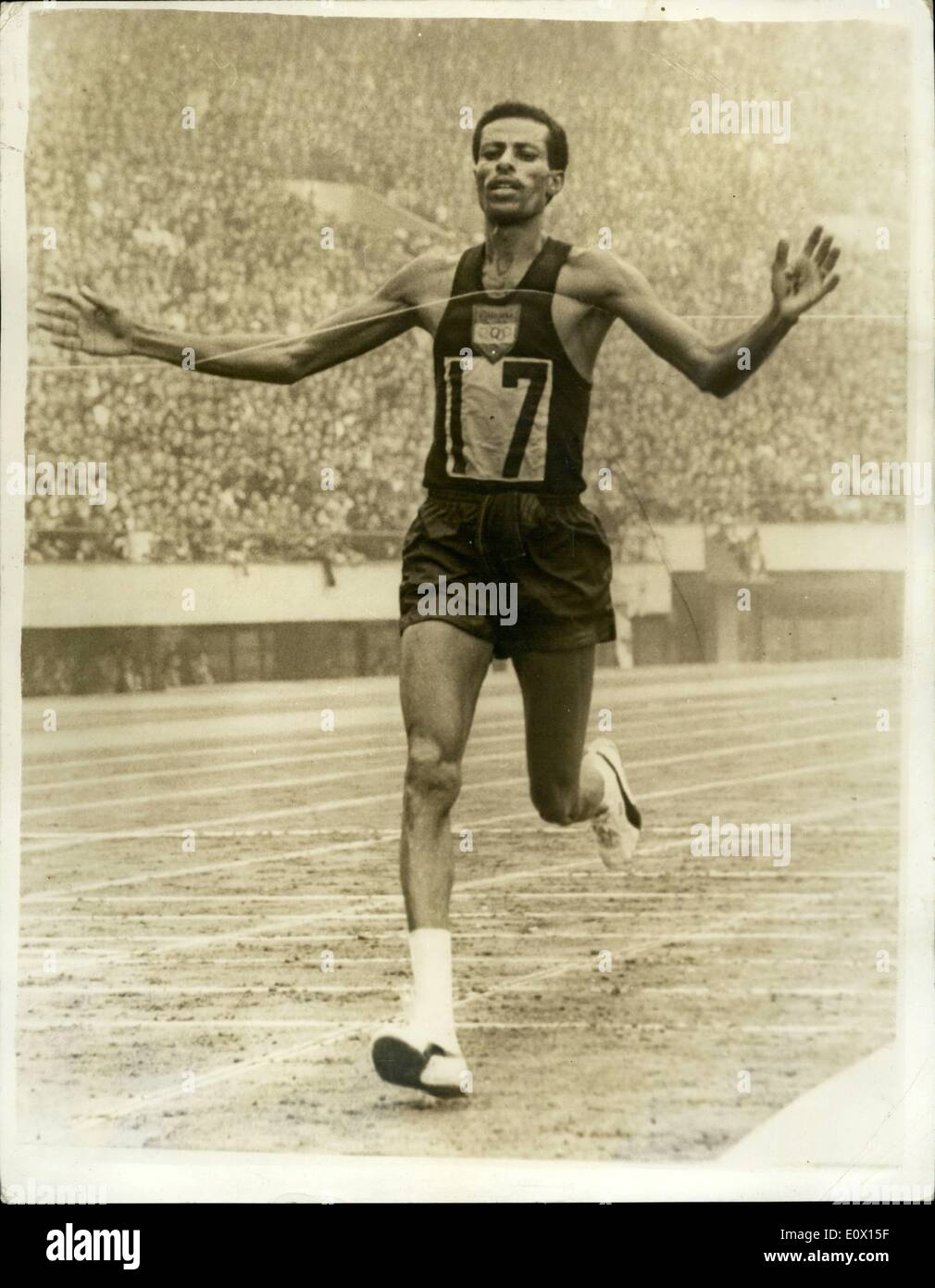 Oct. 10, 1964 - Olympic Games In Tokyo. Marathon Gold Medal For Ethiopia. Photo Shows:- A. Abebe Bikila of Ethiopia seen breasting the tape - to win the Marathon event in a new Olympic record time of 2hr. 12 mins. 11.2 secs. Stock Photo