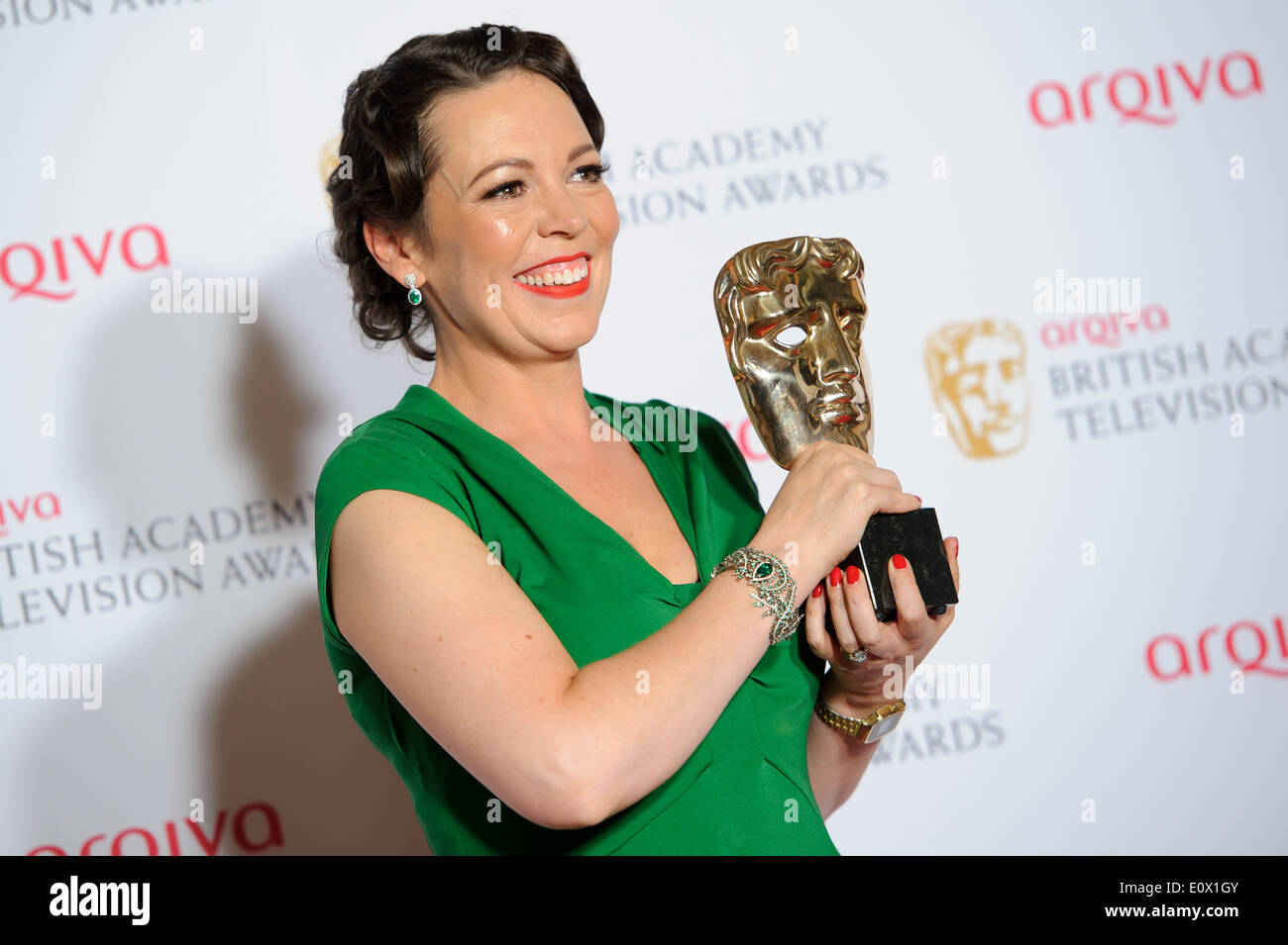 Olivia Colman poses for photographers in the winners room at the British Academy Television Awards. Stock Photo