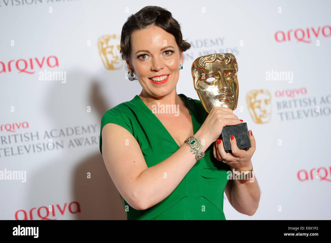 Olivia Colman poses for photographers in the winners room at the British Academy Television Awards. Stock Photo