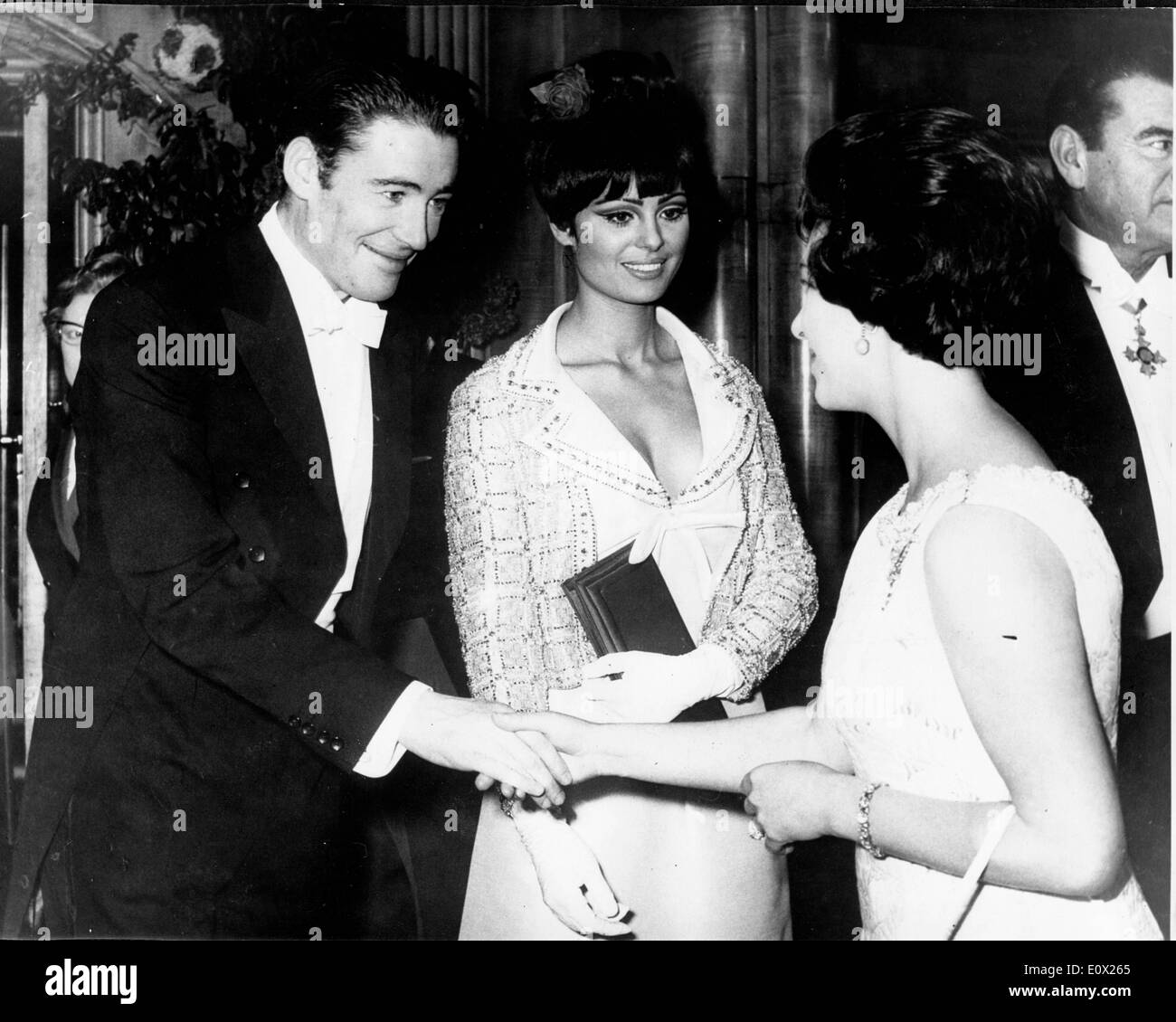 Peter O'Toole and Daliah Lavi meeting Princess Margaret at the Royal premiere of 'Lord Jim' Stock Photo