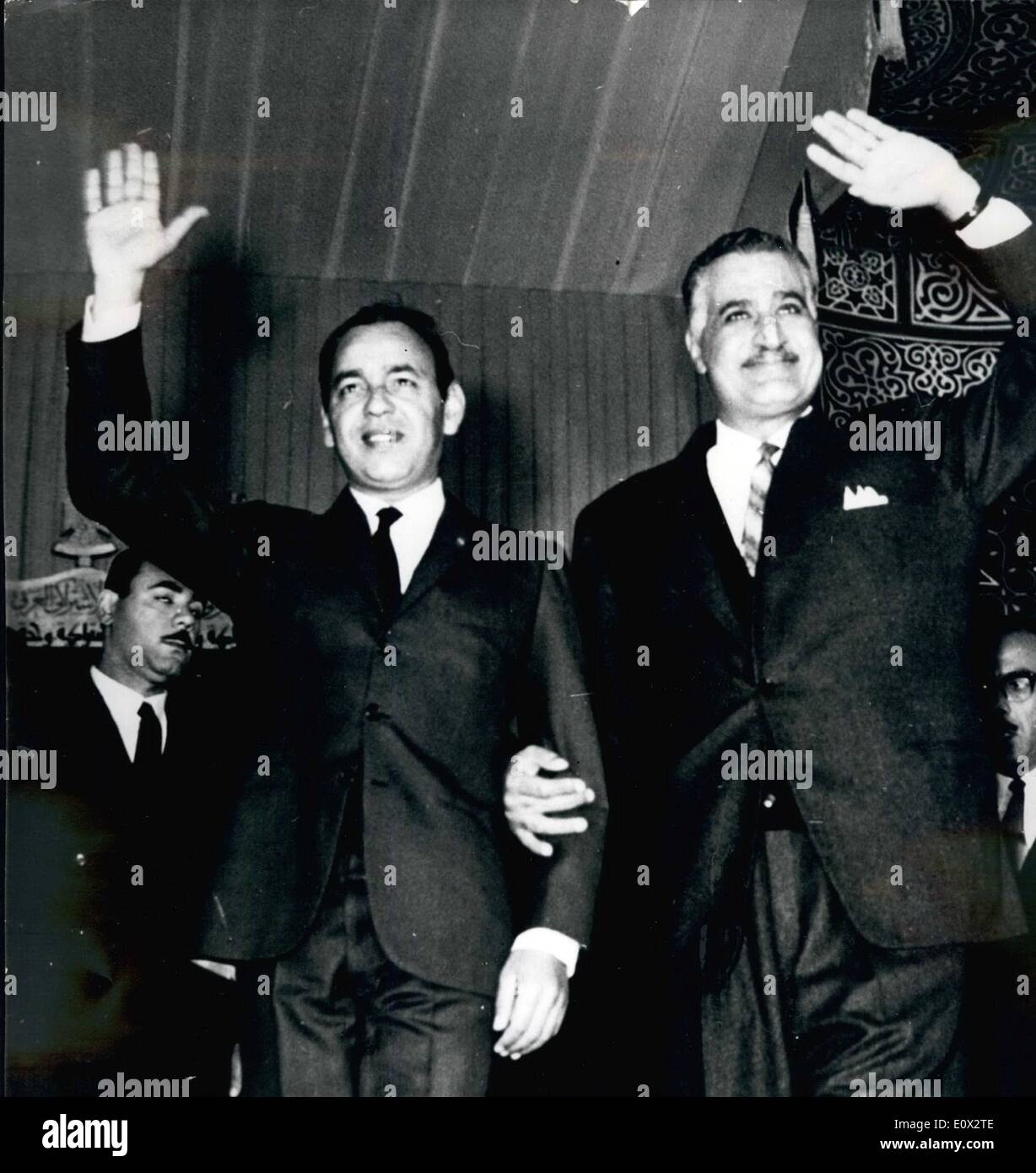 Mar. 03, 1965 - El Hassan and Pres. Nasser Attend Rally... Moroccan King El Hasan II and UAR President Gamel Nasser seen as they raise their hands to acknowledge the cheers of the crowd assembled at the Mass Rally held at Mansoura and which was addressed by both Arab chiefs. It was also part of Pres. Nasser's election tour. Stock Photo