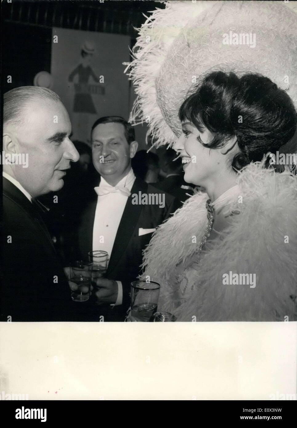 Mar. 13, 1965 - Mr. Pompidou talks with Italian actress Elsa Martinelli at the Artist Union's Gala held at Paris's Winter Circus. Jacques Charron, from the Comedie Francaise, is in the middle. Stock Photo