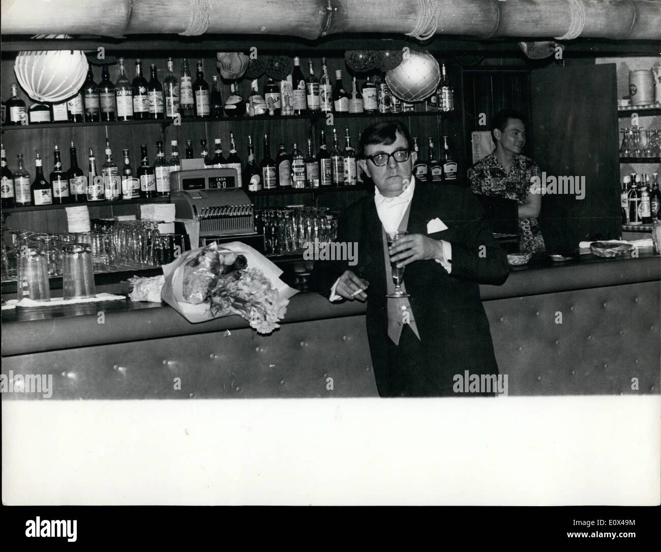 Feb. 02, 1965 - The Loneliest Drinker In Park Lane - Yesterday .......His Victims Could Not ''Forgive-or-Forget''....: Stanley Lowe stands at the bar of the London Hilton Hotel -- in Park Lane yesterday -- and gloomily acknowledges the fact that his victims regret they are unable to lunch today. He claimed that he sent out 20 gilt edged invitations to food and wine -- but nobody was interested -- he says his victim obviously could not ''forgive-or-forget'' Stanley Lowe is the self-styled ''King of the Con men'' -- and the invitations were to the people who over the years he had ''conned'' out Stock Photo