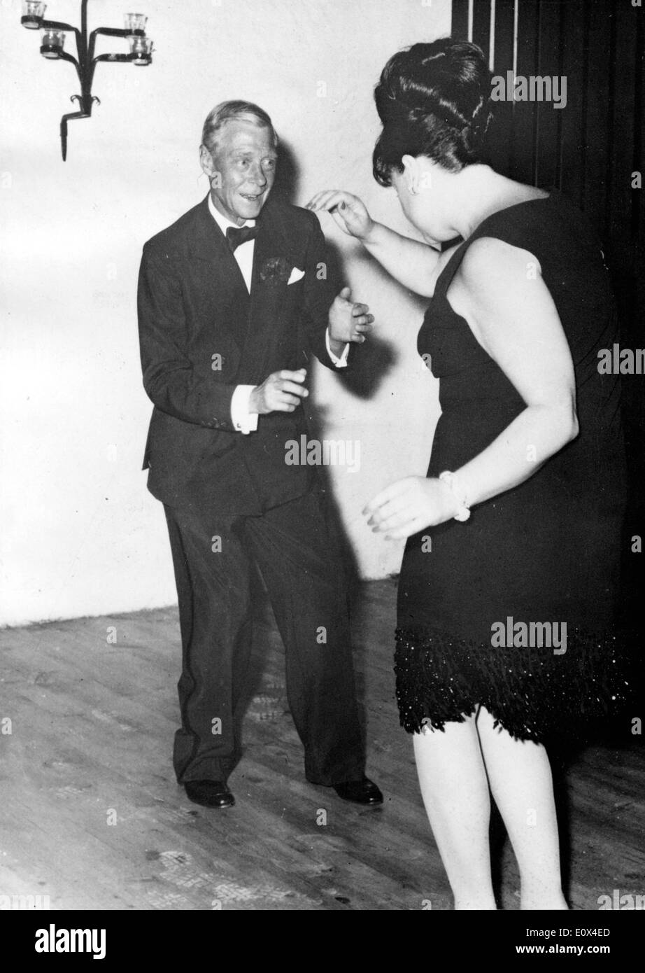 The Duke dances with a 'Square Dance' dancer Stock Photo