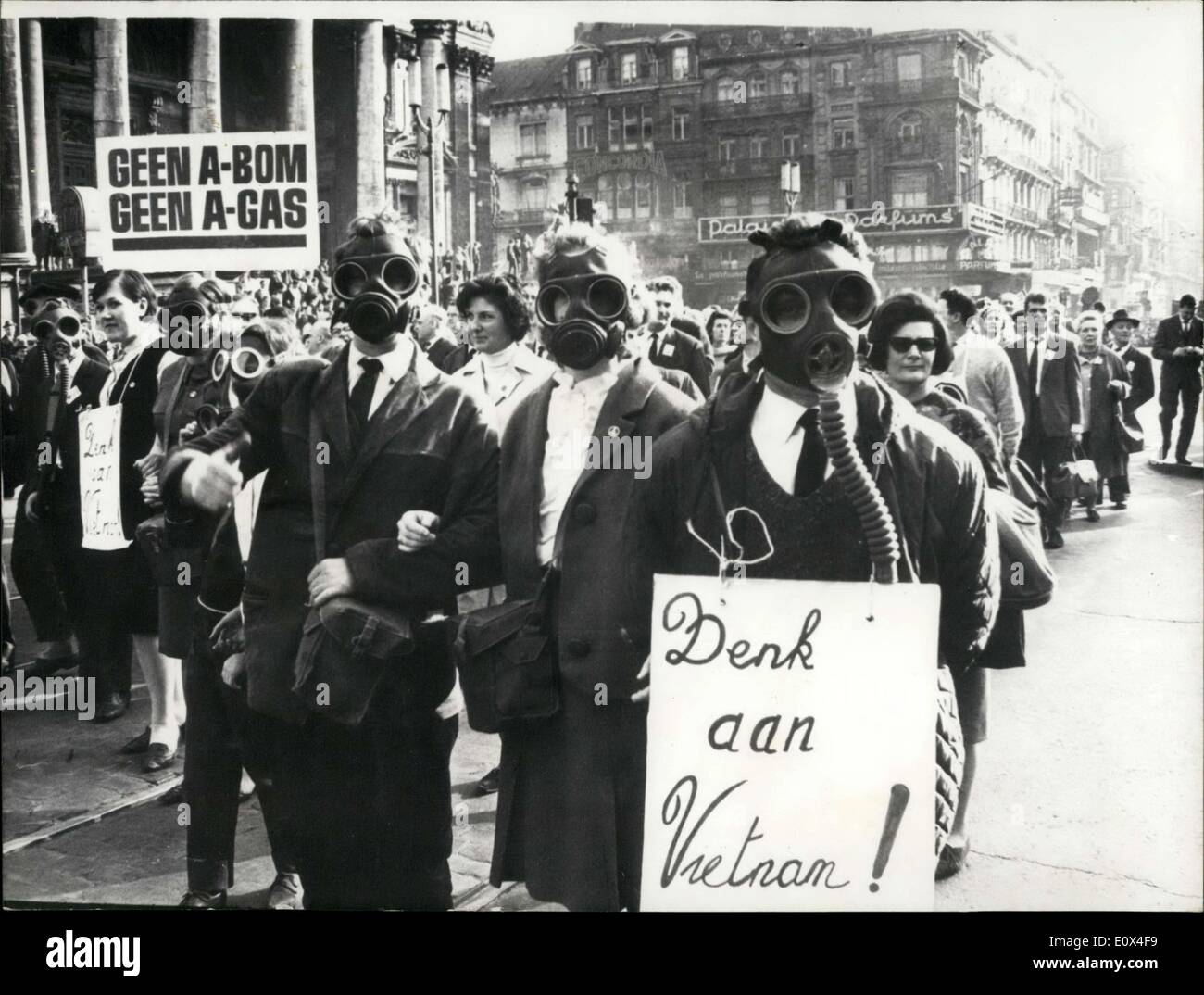 Mar. 29, 1965 - No To Atomic Bomb No To Gas: An Anti-war Demonstration was held in Brussels yesterday. Photo shows Demonstrators wearing gas masks and carrying a poster with the inscription: ''Think of Vietnam''. seen in the foreground a poster with the inscription: ''Bean the A-Bom, Ban Gas! Stock Photo