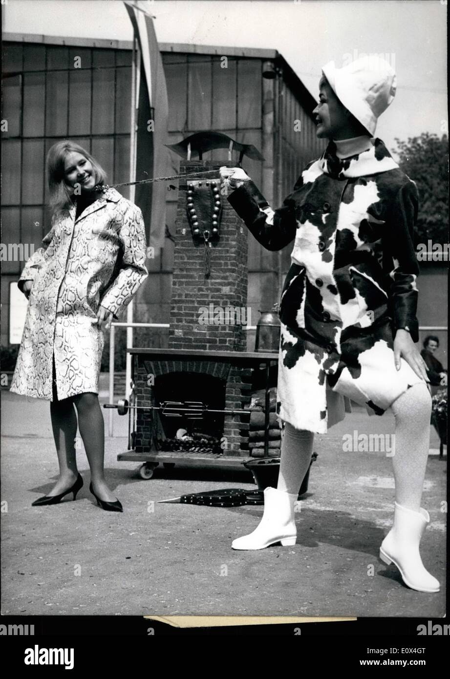 Apr. 04, 1965 - Funny fur fashions are presented on the International Fur Show in Frankfurt. The model at right wears a new styled ''slack-coat'' made of genuine calf while she has attached on a line her concurrence, wearing a coat of true python snake. Which gives us an impression of the old story of ''Eva and the snake' Stock Photo
