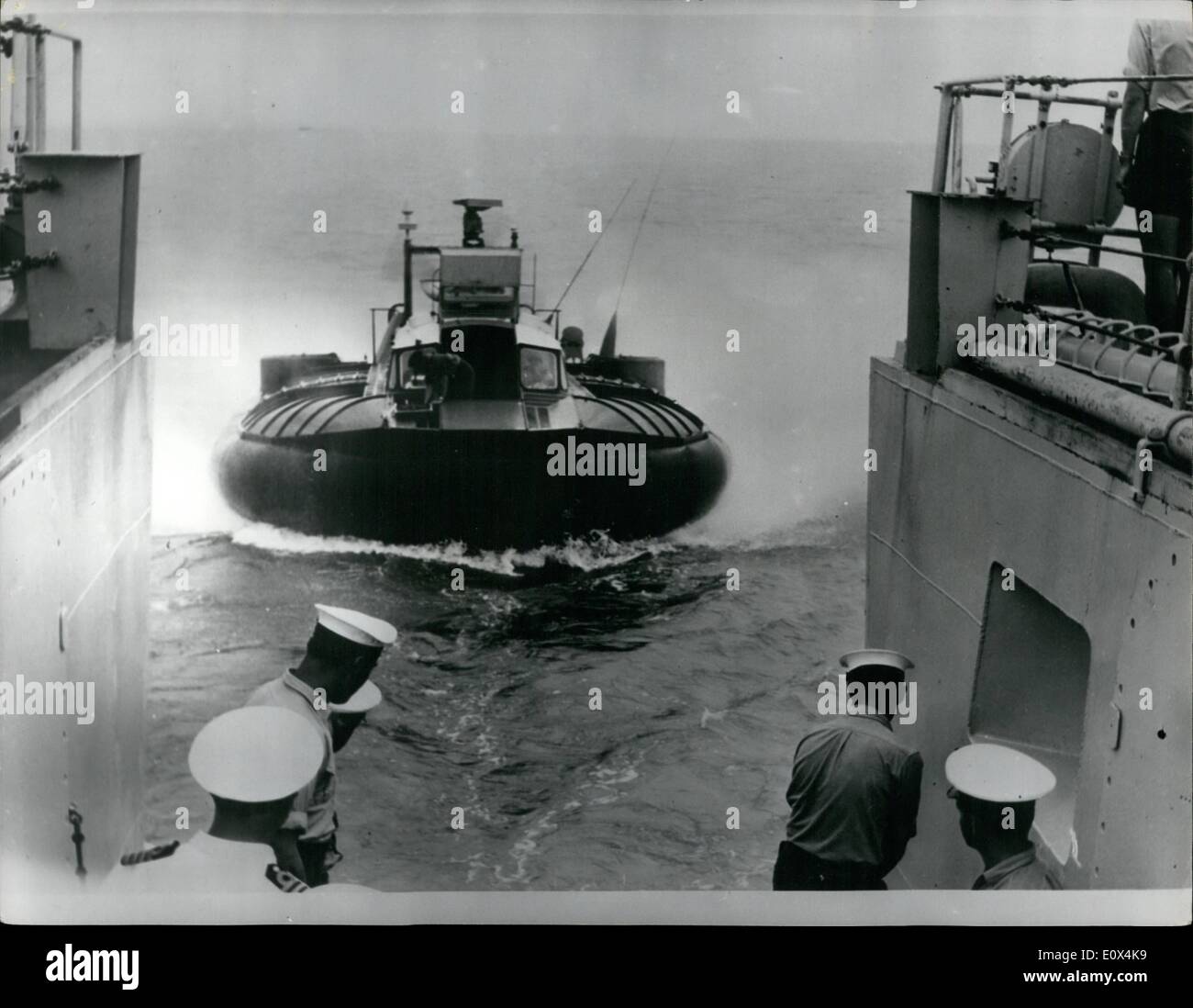 Feb. 02, 1965 - Hovercraft Delivers Mail To The Navy... Picture received from Singapore of the SRN-5 experimental armoured hovercraft which are undergoing extensive trials in the Far East. here is the SRN-5 approaching H.M.S. Ajax bringing the Commander Far East Fleet - View Admiral Sir Frank Twiss from Singapore to embark for an anti-infiltration patrol in the frigate - as well as a consignment of mail for the ship's company. In this picture the Hovercraft approaches H.m.S. Ajax at Sea -off Singapore. Stock Photo