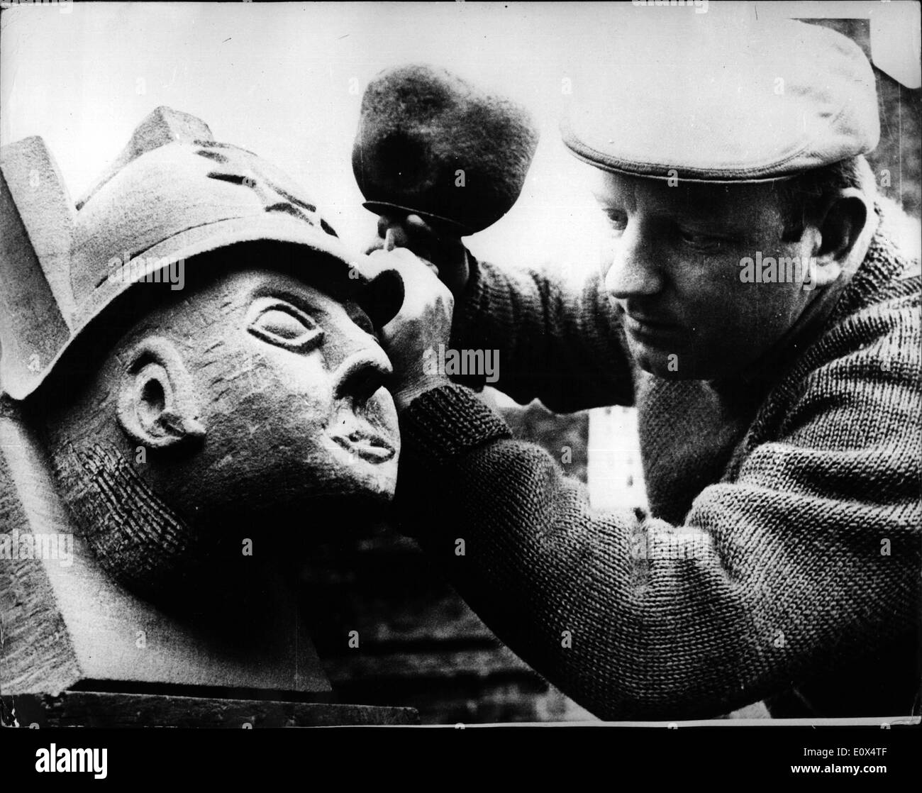Apr. 04, 1965 - Bust of Police Hero for Carlisle Cathedral, A stone bust of police hero Constable George Russell, who - was shot dead at Oxenholme (Westmoreland) in February being made at Carlisle Cathedral, was completed yesterady. The bust is to get a piece of honour among ancient kings and bishops at the Cathedral, where Constable Russell, 35, was given a civic funeral. It is being hewn out of red sandstone by Ted Drinkwater (in picture), a foreman mason, and will be put in its place in the 12th. century cathedral. The tribute was the idea of the cathedral architect, Mr Stock Photo