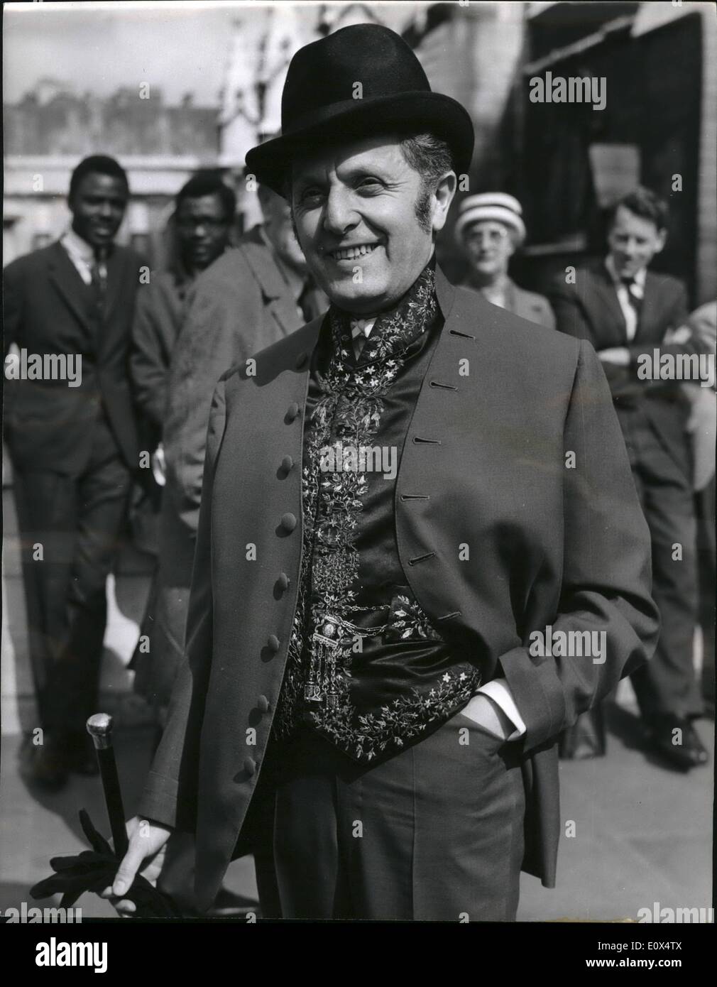 Apr. 04, 1965 - Mr. abse turns up for the budget in his ''hot suit'' : Mr. Leo Abse the labour M.p. for pontypool turned up at the house of commons today for the budget wearing securry -colored suit - with a strong 18th. century influence - including a waistcoat of the period. This outfit was topped by a very special hat which he had imported from Paris. Mr. Abse makes a point of being strikingly dressed for all parliamentary occasions. photo shows Mr. Leo Abse - with his ''hot Suit'' - waistcoat and hat - on arrival at st. stephen's entrance - for the budget today. Stock Photo