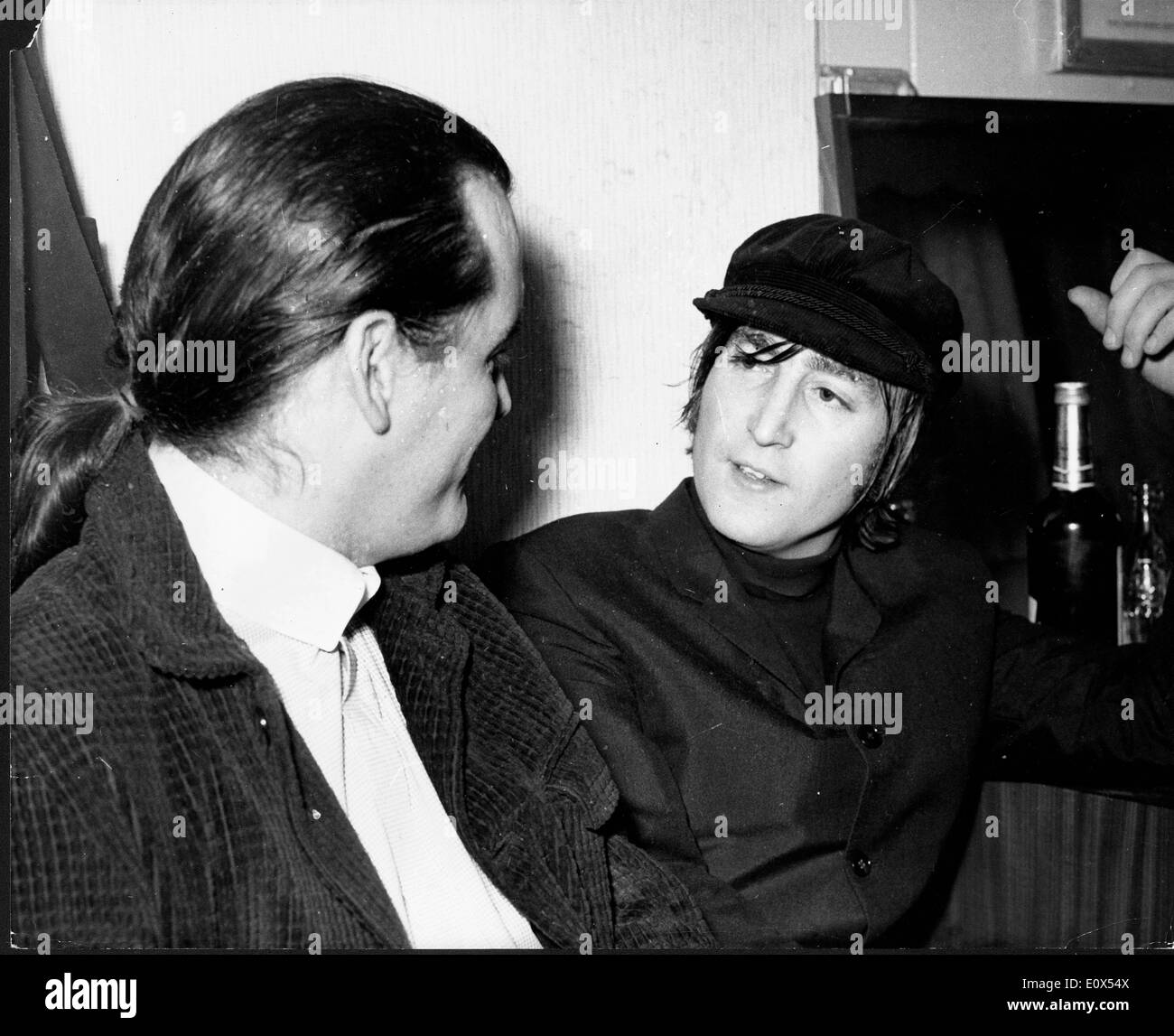 Beatles singer John Lennon visits with P.J. Proby Stock Photo