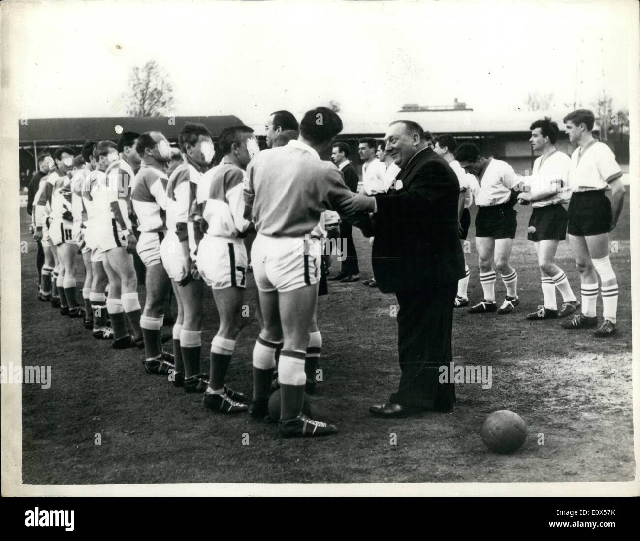 Apr. 04, 1965 - Prison Football Team win a cup final.: The football team from Chelmsford Prison, were last night allowed out for the first time to take part in the Division 11 Cup Final of the Wild-Essex Combination - against Thexted village football club, at the Chelmsford City ground.The prsion team won by 6 goals to 4. Captain W.I Davies, the prison Governor was at the match to cheer the prison team to victory. Photo shows an official of the Mid-Essex Combination - shaking hands withe the prison team prior to the match last night Stock Photo