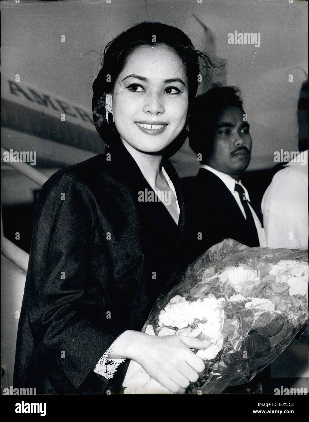 Jun. 06, 1965 - President Sukarno's new wife visits London: Ratna Sari Dewi, 24, the beautiful Japanese wife of Dr. Sukarno, the Indonesian President, arrived by air to London airport yesterday on her first visit to London. Madame Sukarno, one of the President's three wives as a Moslem he is allowed four is here to attend the delayed wedding party of her friend, the new Viscountess Newry, who married the Earl of Kilmorev's heir in Hamburg this month. Photo shows Madame Sukarno pictured on her arrival at London Airport yesterday. Stock Photo