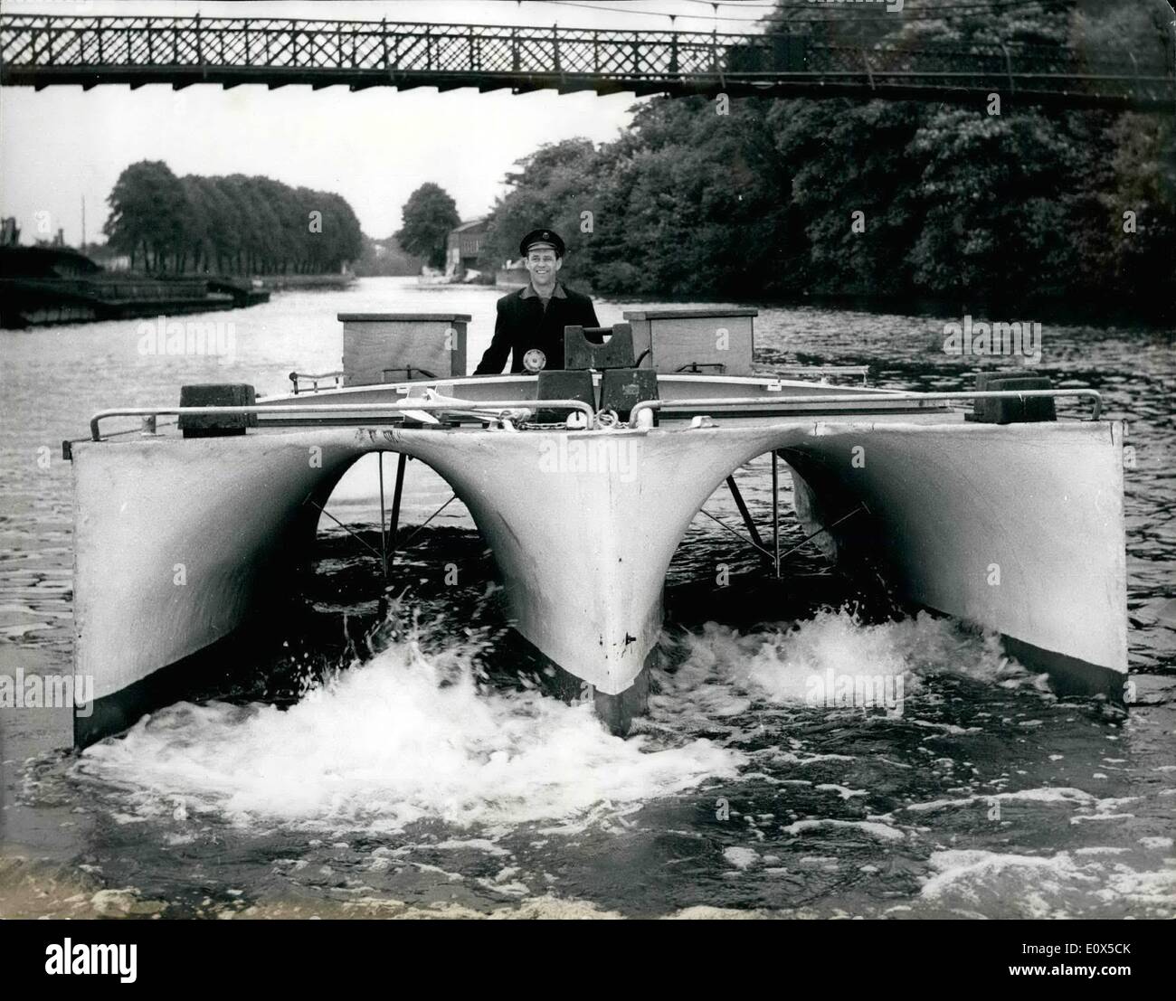 Jun. 06, 1965 - A Revolutionary ship's hull is demonstrated at Hampton. A twenty - foot self powered model of a revolutionery ship's hull was demonstrated on the Thames at Hampton today. The model named ''Confounder'' is the work of 69 year old Alfred Burgess of Putney, who for years has been trying to overcome some of the basic drawbacks to the conventional ship's hull. The Burgess boat is powered by two ten h.p. motors is three hulled, comprised of a main inner hull and two outer half - hulls , joined by a common deck on top and by two webbe at the bottom athwart- ships Stock Photo