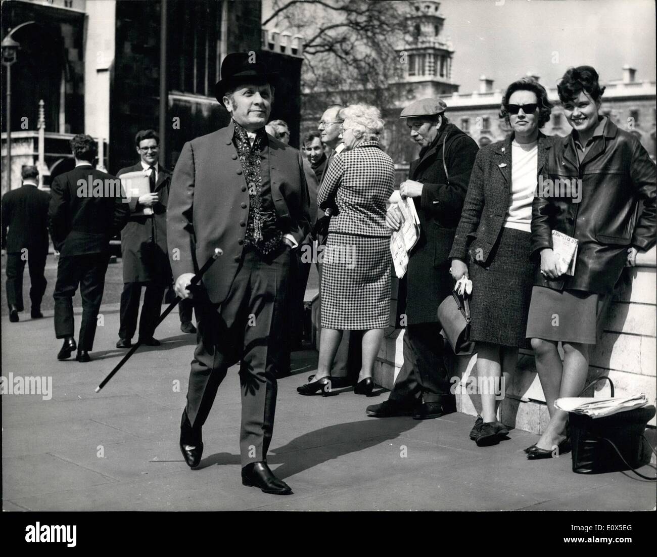 Jun. 06, 1965 - Mr. Abse turns up for the budget in his Hot Suit . Mr. Leo Abse, the Labour M.P. for Pontypool turned up at the House of Commons today for the Budget wearing a curry-coloured suit with a strong 18th Century influence including a waistcoat of the period. This outfit was topped by a very special hat which he had imported from Paris. Mr. Abse makes a point of being strikingly dressed for all Parliamentary occasions. Keystone Photo Shows: Onlooker watch as Mr. Leo Abse walks past on way to the House of Commons this afternoon in his Hot Suit for the budget. Stock Photo