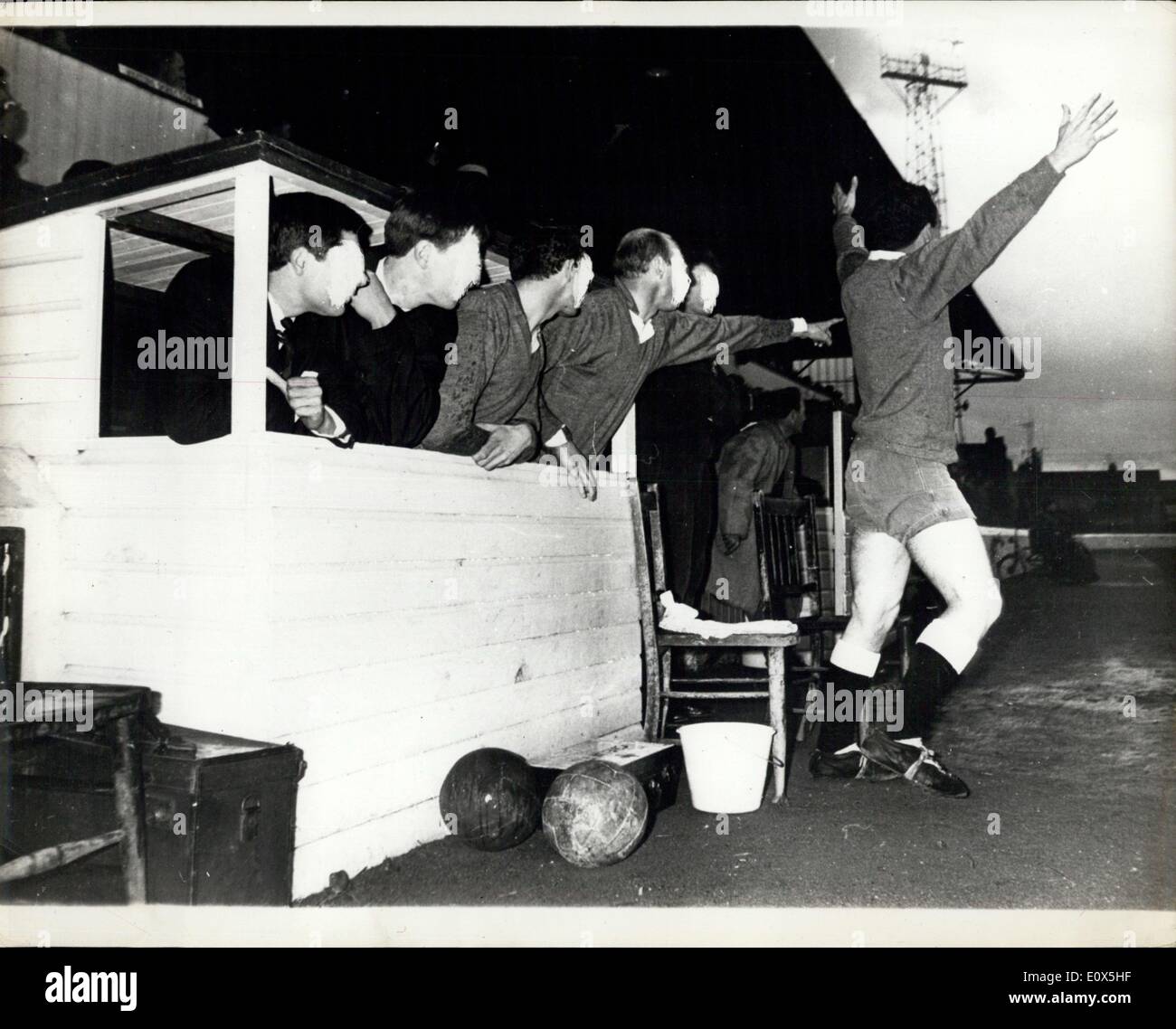 Apr. 27, 1965 - Prison football team win a Cup Final ? The football team from Chelmsford Prison, were last night allowed out for the first time to take part in the Division 11 Cup Final of the Mid-Essex Combination against Thaxted village football club, at the Chelmsford City ground. The prison team won by 6 goals to 4. Captain W.I. Davies, the prison Governor, was at the match to cheer the prison team to victory. Photo Shows: The reserves of the prison team (their faces are erased to prevent their identity) lot up a cheer as their team score a goal. Keystone Stock Photo