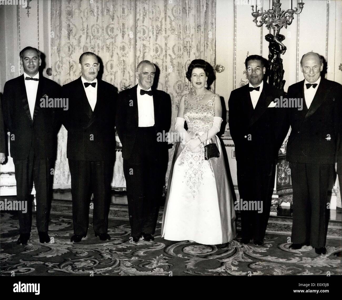 May 04, 1965 - Queen Elizabeth With Council Of Ministers Of Seato: Queen Elizabeth seen with members of tenth meeting of the Council of Ministers of the South East Asia Treaty Organisation, after dinner at Buckingham Palace, last night. (Left to Right) : Mr. Zulfikar Ali Bhutto, Pakistan Foreign Ministers; The Hon. Paul Hasluck, M.P., Australian Minister for External Affairs; Michael Stewart, Britain's Foreign Minister; H.M. The Queen; Mr. Konthi Suphamongkhon, Secretary General of Seato, and The Hon. D.J. Eyre, M.P., New Zealand defence minister. Stock Photo