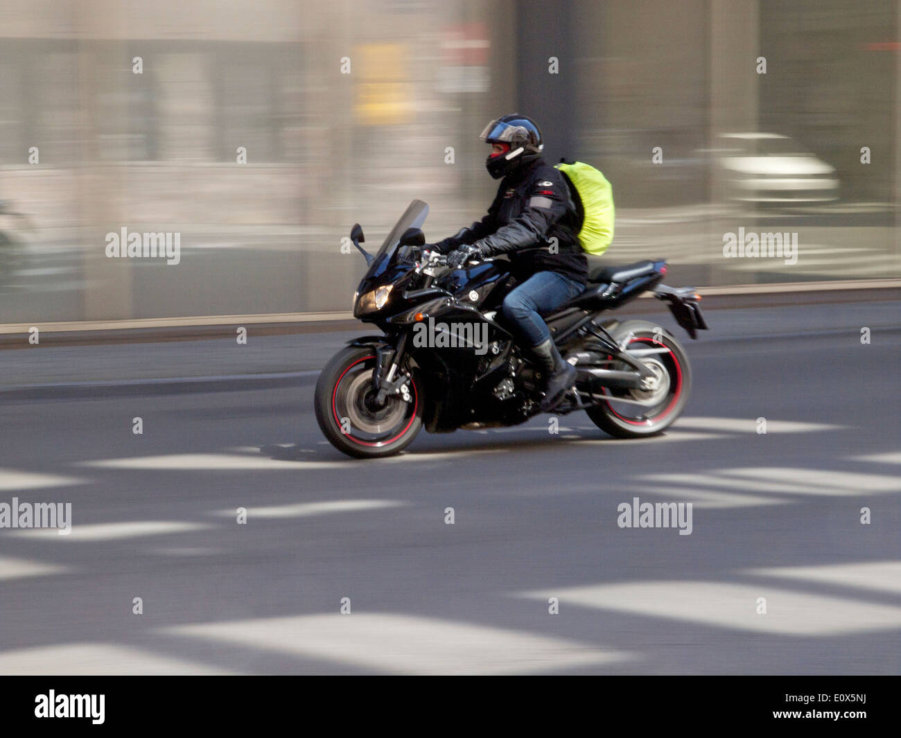 Commuting by motorcycle on the Wetstraat in the city center of Brussels, Belgium, Stock Photo