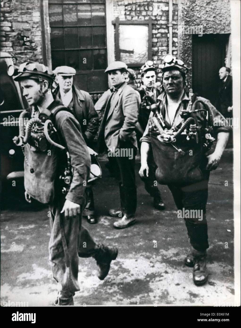 May 05, 1965 - 31 miners die in pit disaster. 31 miners died in an explosion yesterday at the Cambrian Colliery, near Tonypandy, in the Rhonda valley. photo shows Grim - faced rescue workers pictured before entering the disaster pit. Stock Photo