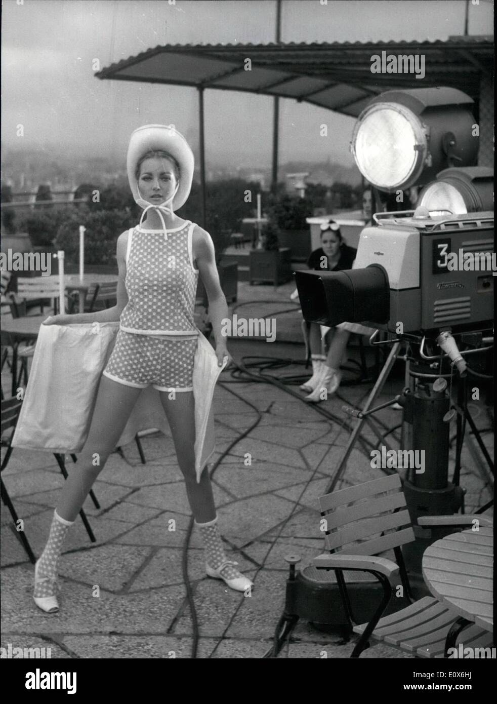May 05, 1965 - American T.V. Viewers could see in direct Transmission a Paris Fashion show thanks to the ''Early Bird'': A direct transmission of a Paris fashion show could be seen by American T.V viewers thanks to the early Bird. Photo shows A mannequin Modelling beach fashions before a T.V camera on the roof of a department store. Stock Photo