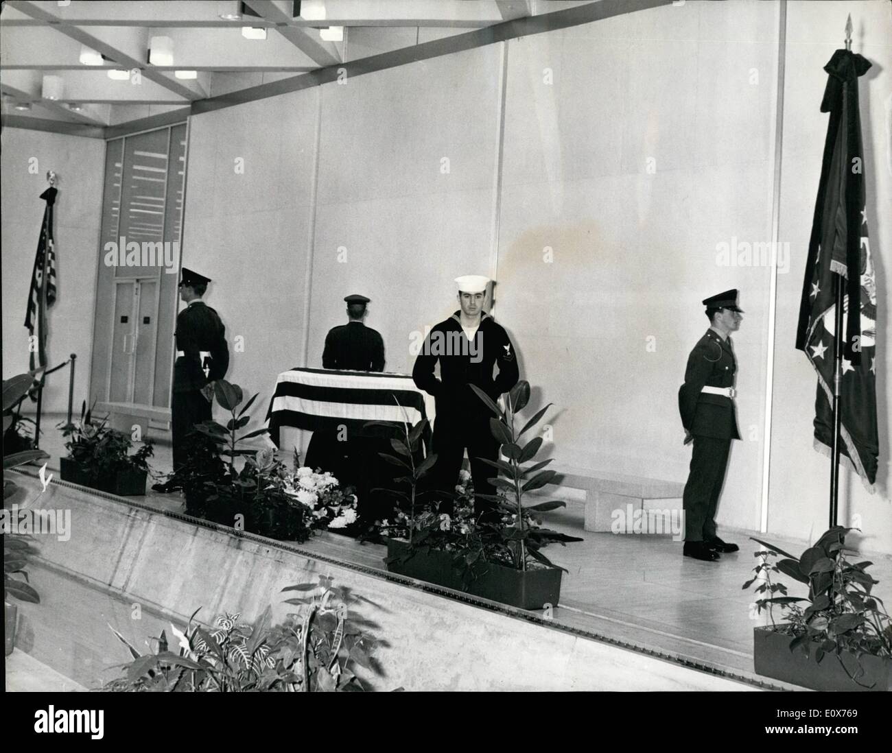 Jul. 07, 1965 - Death of Adlai Stevenson. Mr. Adlai Stevenson, America's Ambassador to the United Nations, who was in London on a private visit, died in a London street last night. He collapsed near the U.S. Embassy in Grosvenor Square. Keystone Photo Shows: The coffin containing the body of Adlai Stevenson lying in the U.S. Embassy today, with British and American Servicemen on guard. A special delegation will take the body back to the U.S.A. H/Keystone Stock Photo
